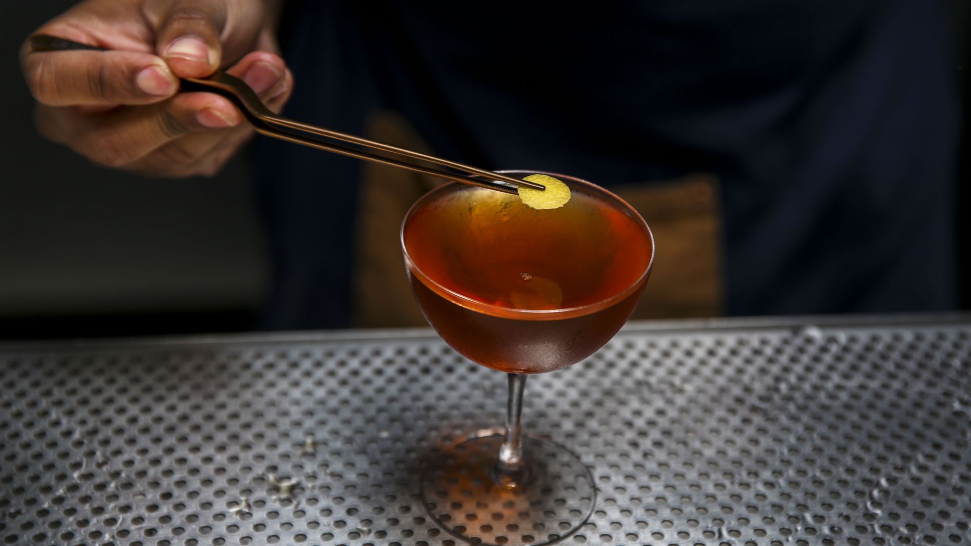 Bartender Jared Murray places a lemon circle on top of a Spice and Everything Nice, a non-alcoholic cocktail, at True Laurel Sunday, July 7, 2019, in San Francisco, Calif. (Photo By Josie Norris/The San Francisco Chronicle via Getty Images)