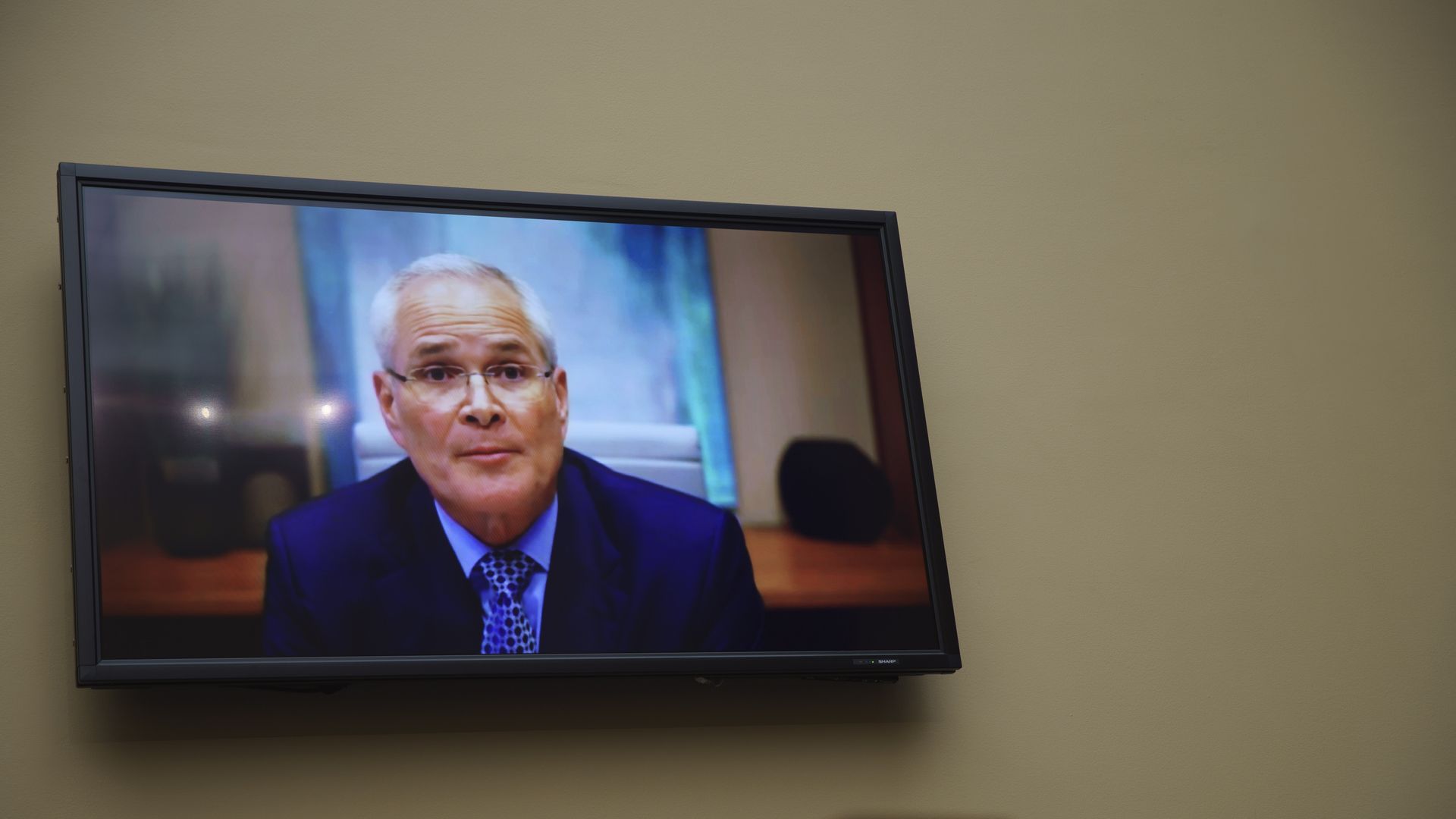 ExxonMobil CEO Darren Woods testifies to the House via videoconference.