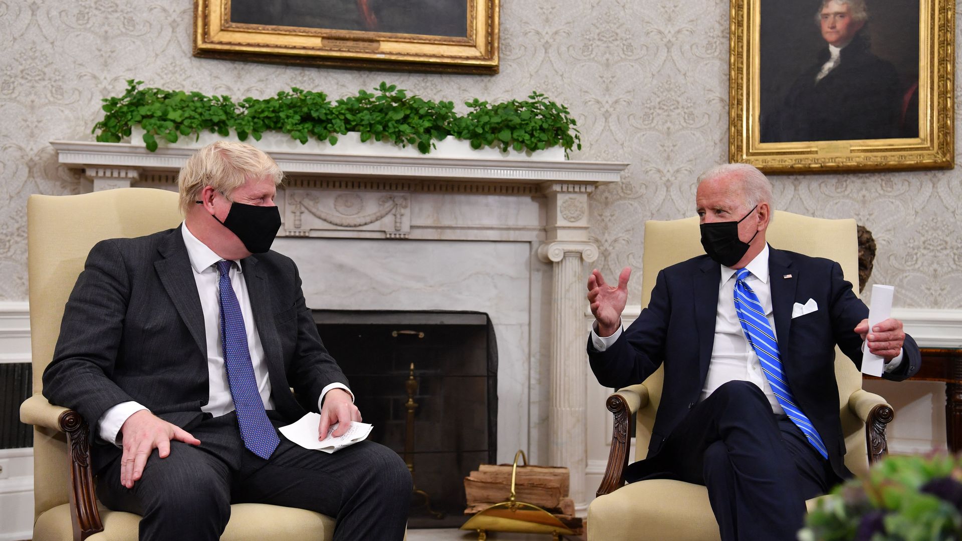 President Biden is seen meeting with British Prime Minister Boris Johnson in the Oval Office.