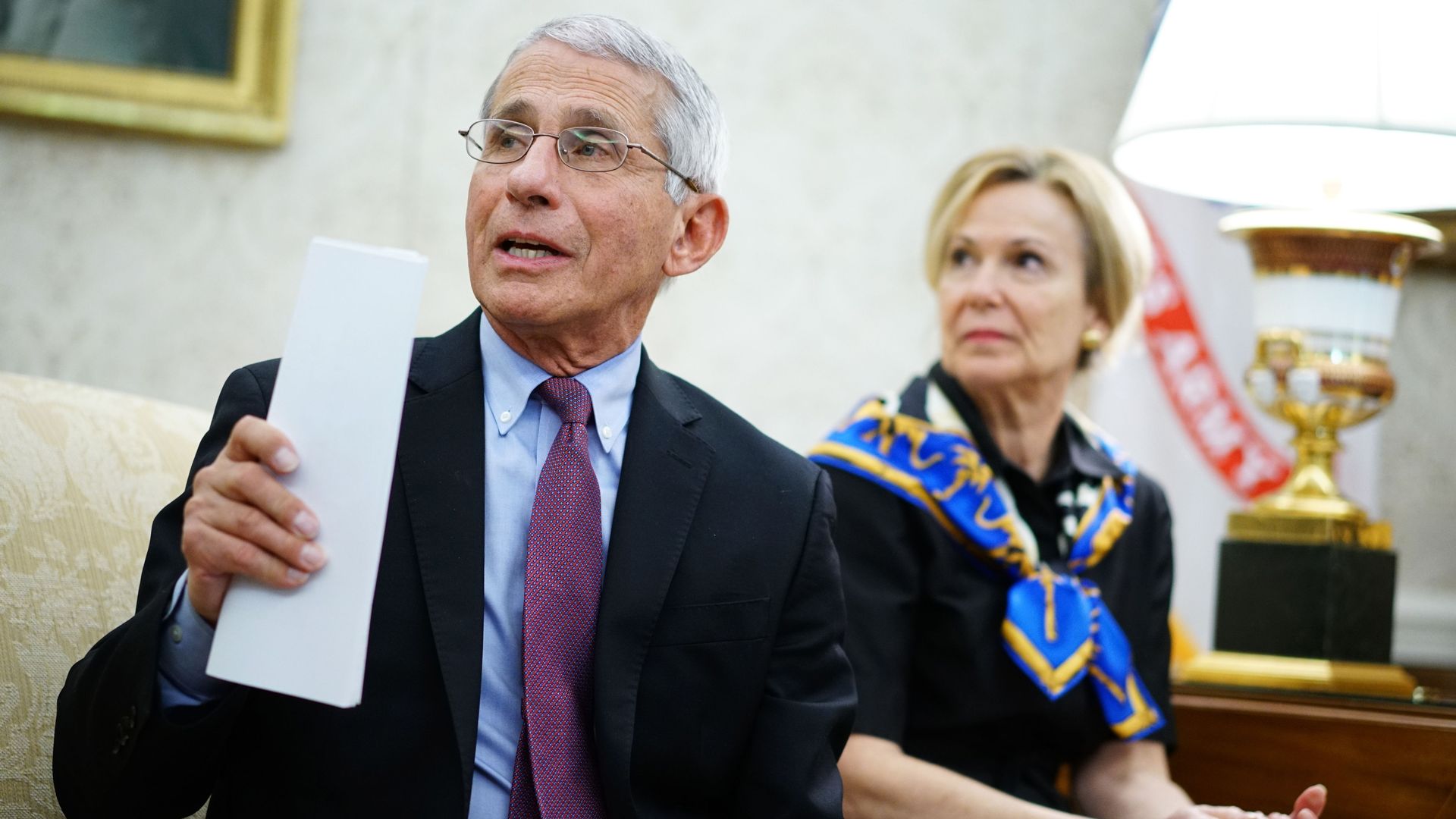 In this image, Anthony Fauci sits in front of Dr. Birx