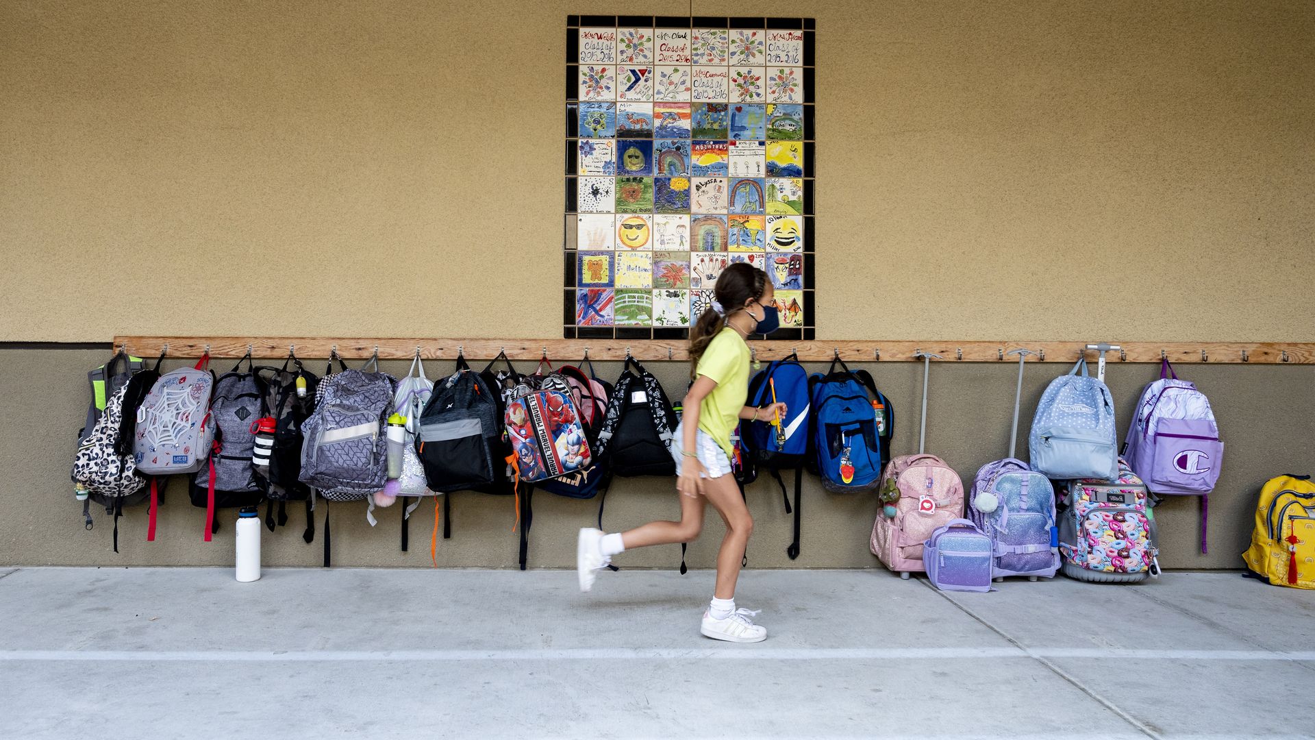 A student rushes to her classroom for the first day of class in Laguna Niguel, California on Aug. 17.