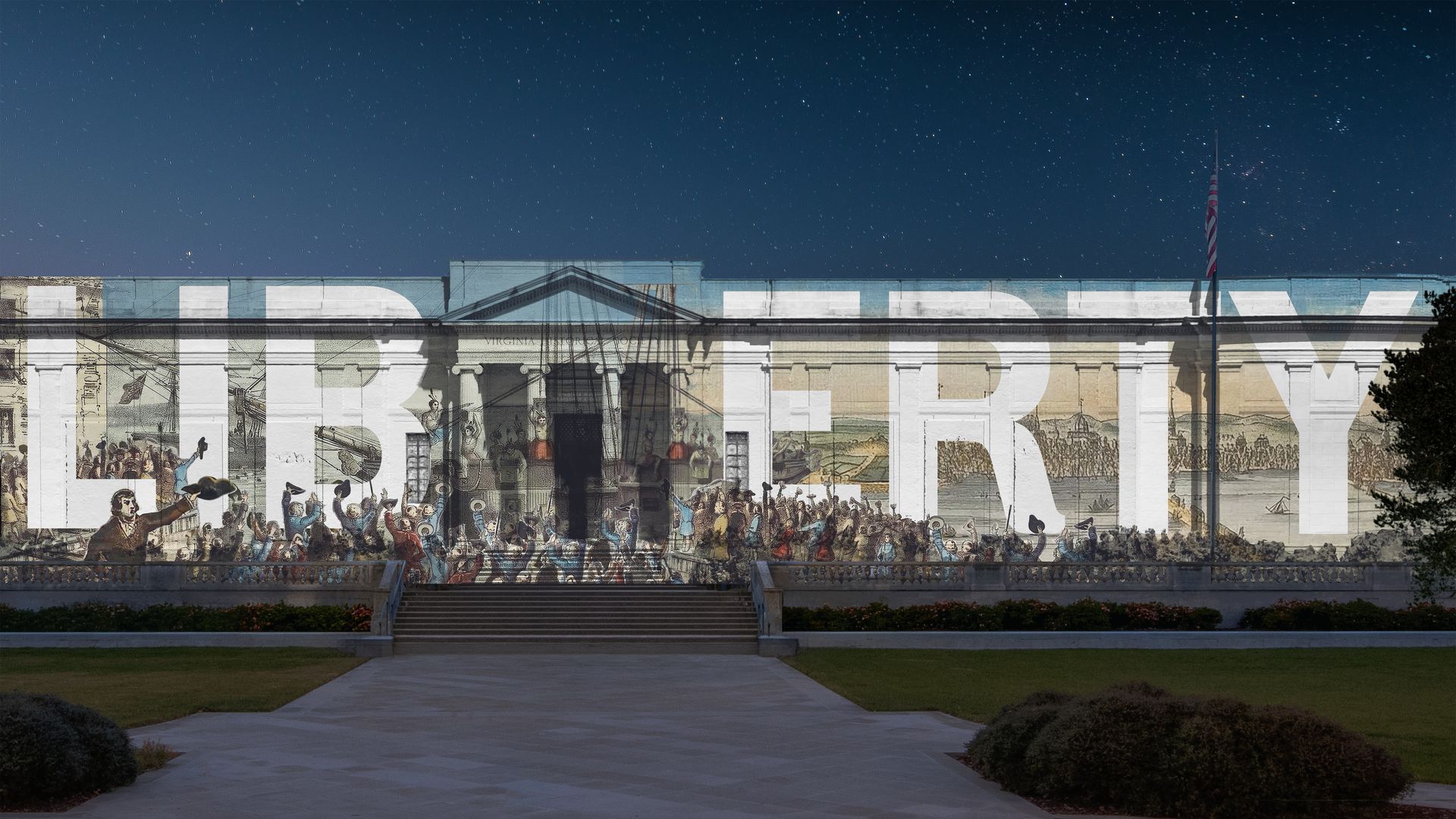 Night shot of a white neoclassical building with a large LIBERTY mural across its façade, crowd scenes painted on the wall, an American flag on a pole, and a starry sky above.