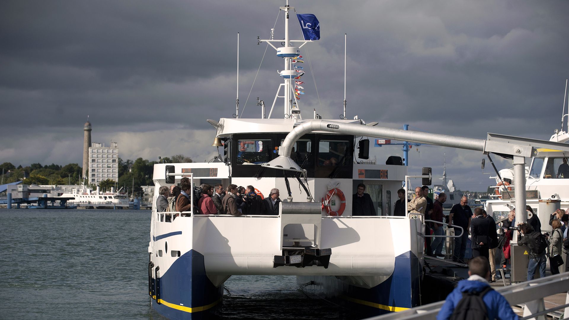 passangers boarding an electric ferry on a river in France