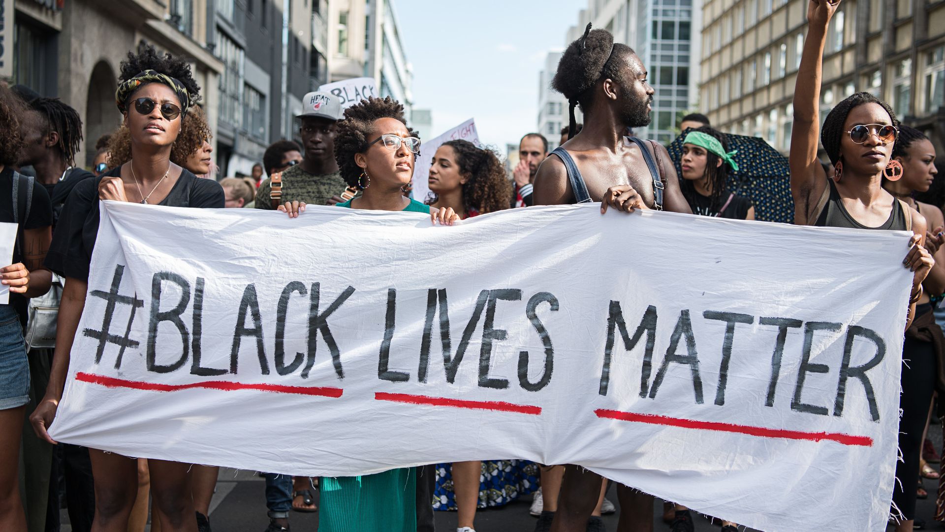 Protesters hold a Black Lives Matter banner. 