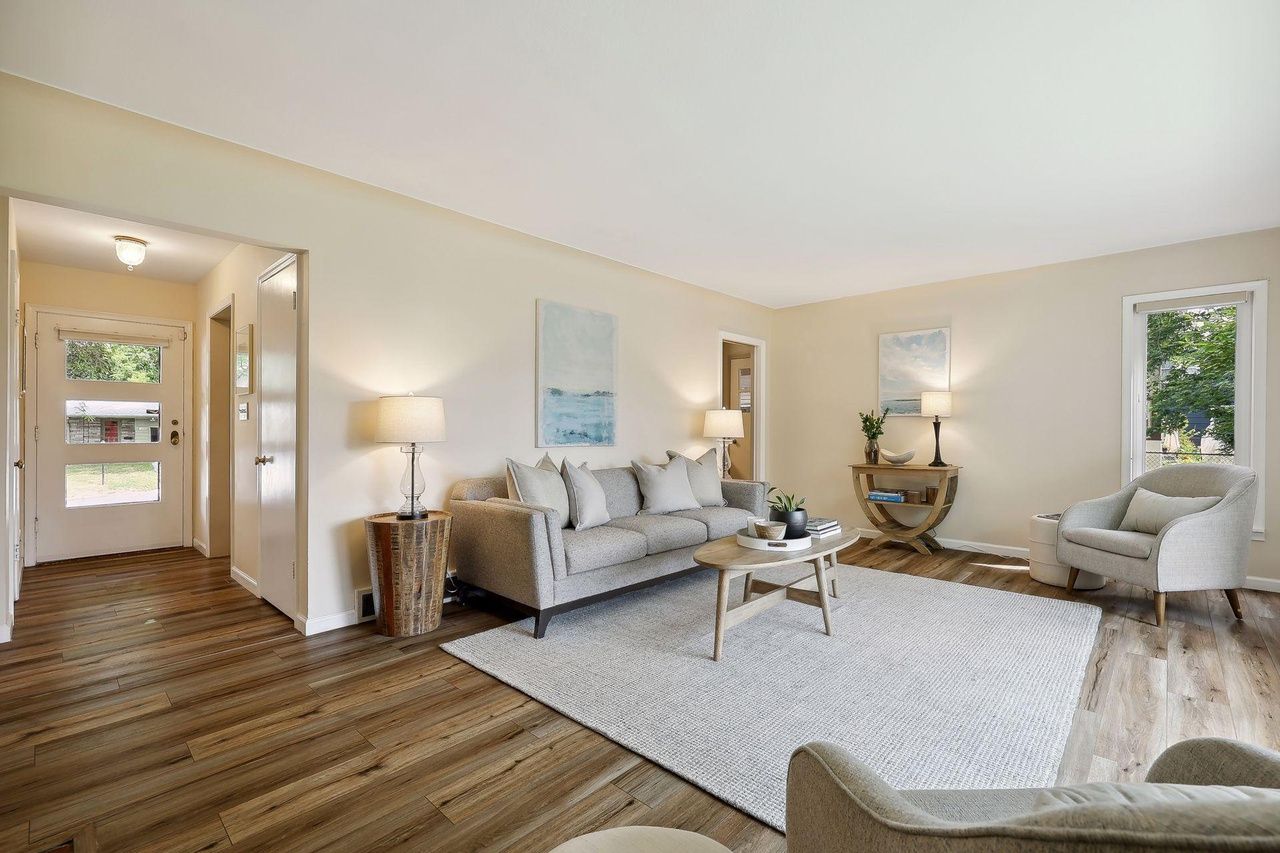 living room off front entryway with view of backyard