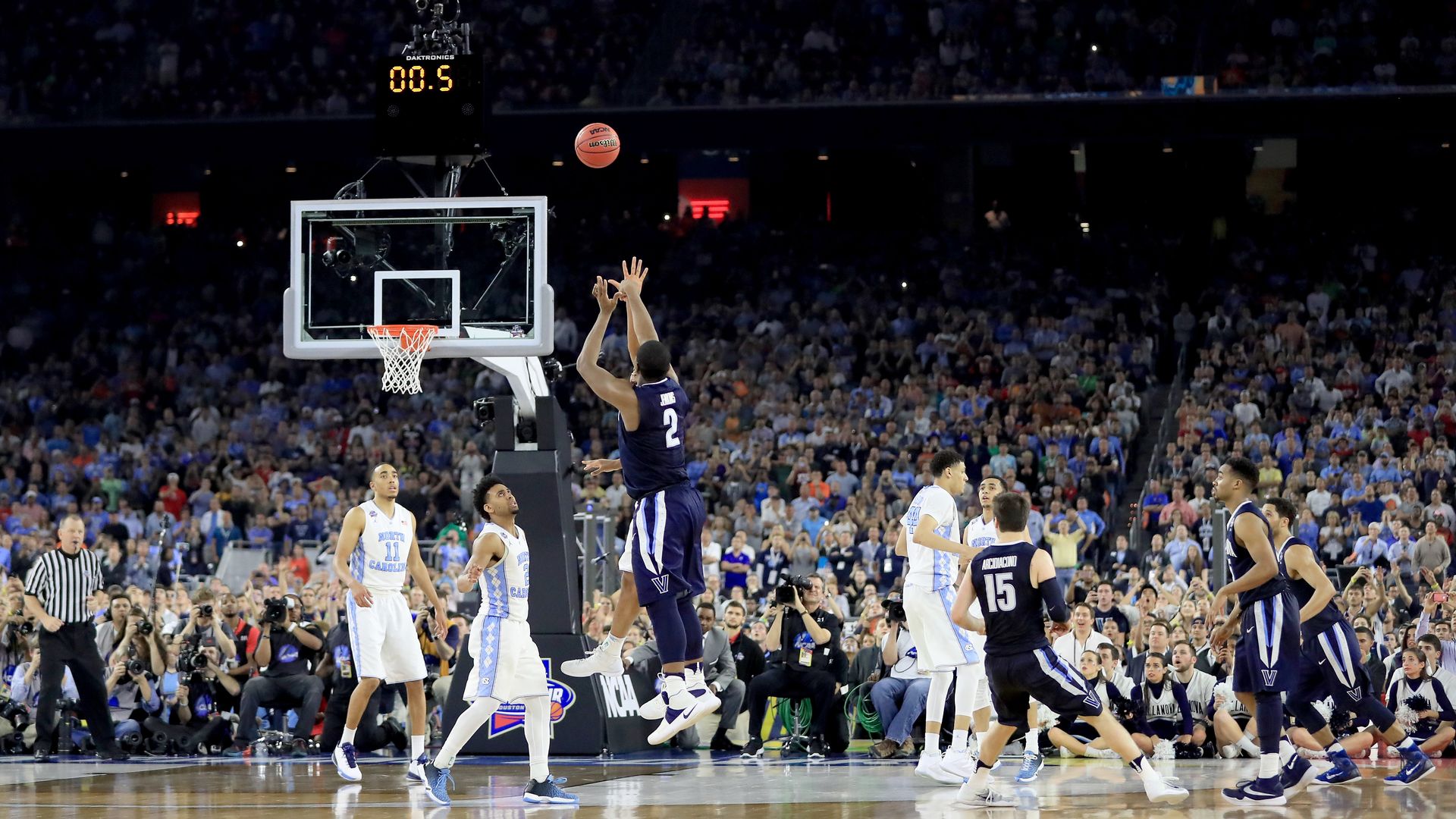 Kris Jenkins of the Villanova Wildcats shoots a game-winning three-pointer with the clock at 0.5. 