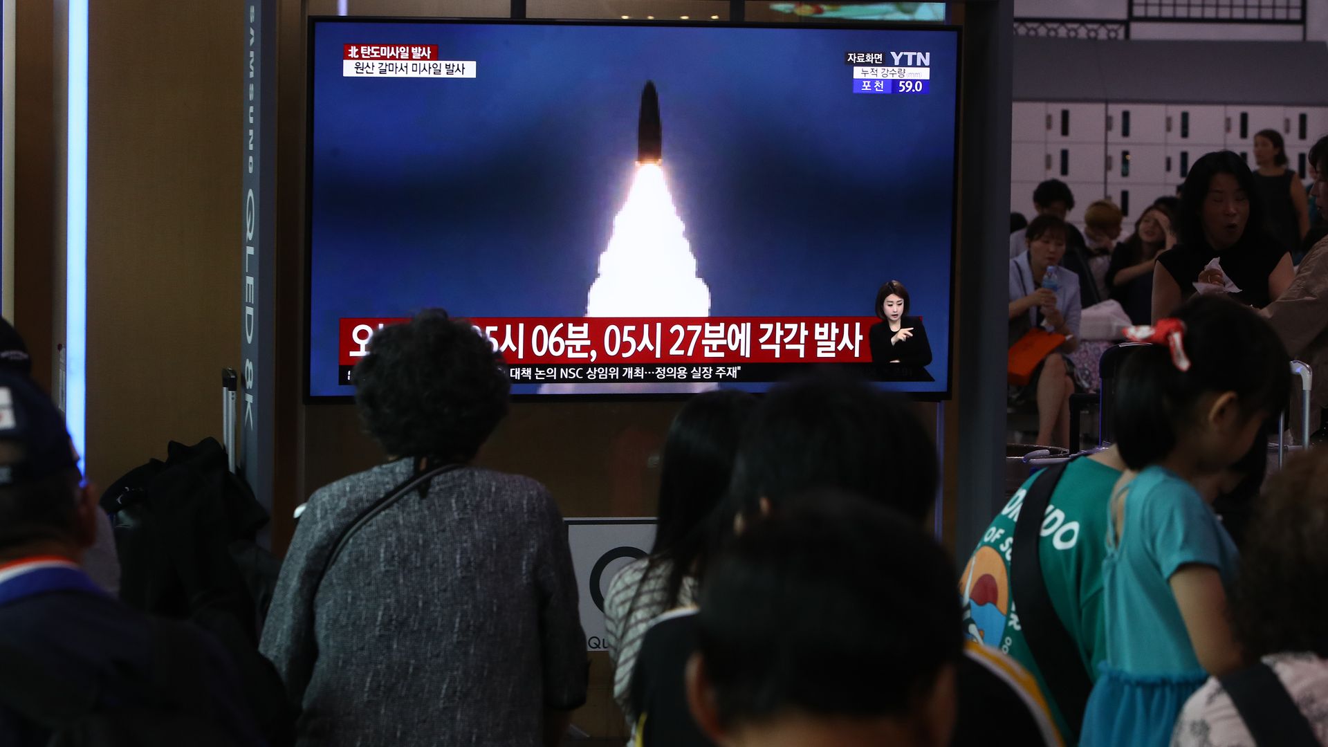 North Koreans watching missile test