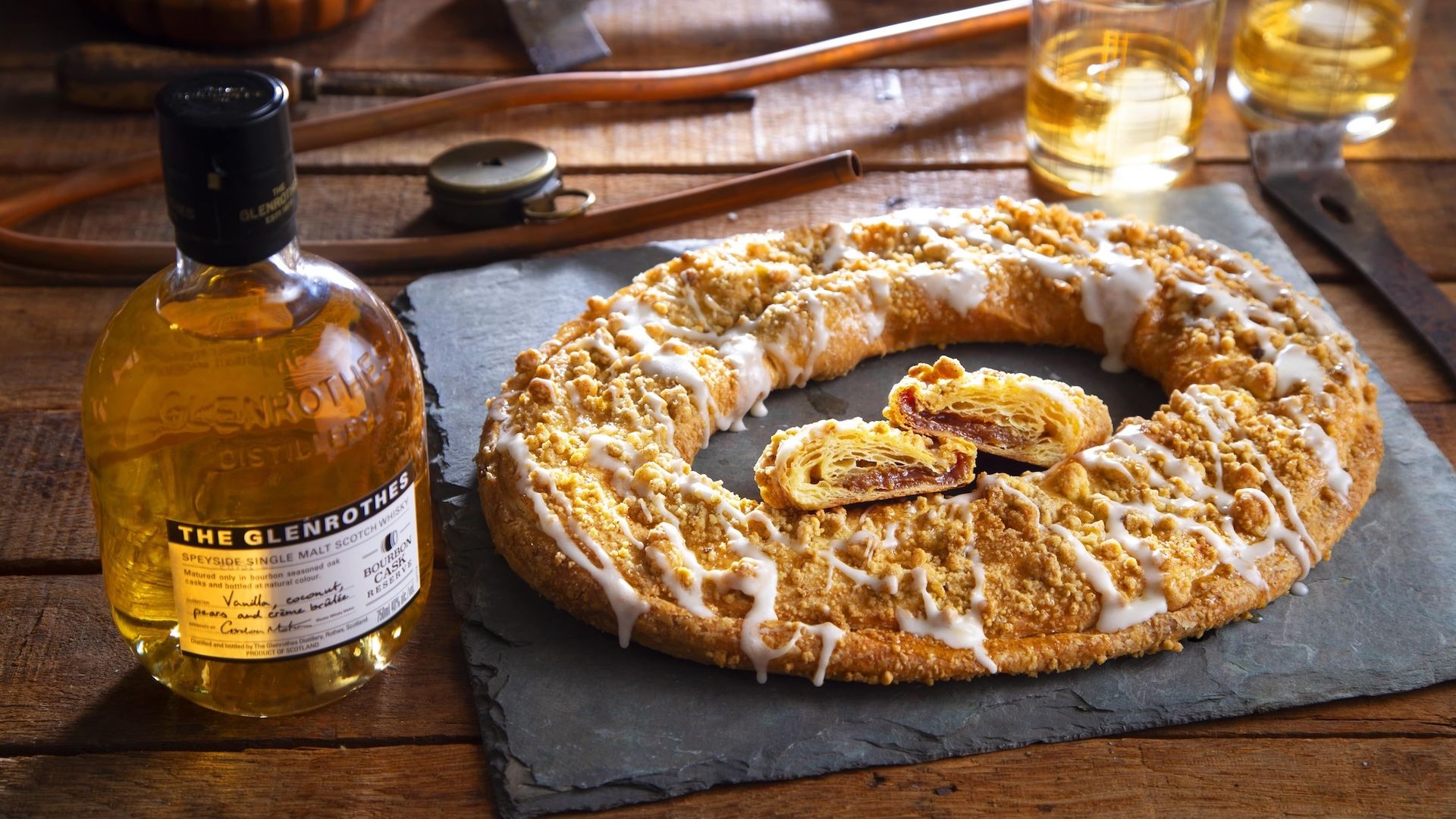 Photo of a pastry next to a bottle of whisky