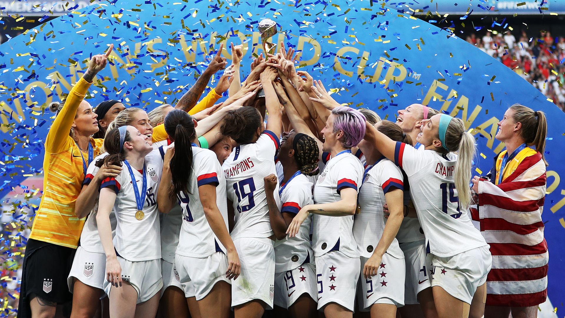 The Women's team hoisting their trophy.
