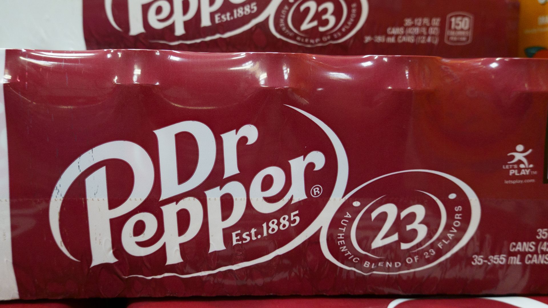 Pack of Dr Pepper soda cans with red packaging featuring white logo, stating "Authentic blend of 23 flavors," containing 35 cans of 355 ml each, established in 1885.