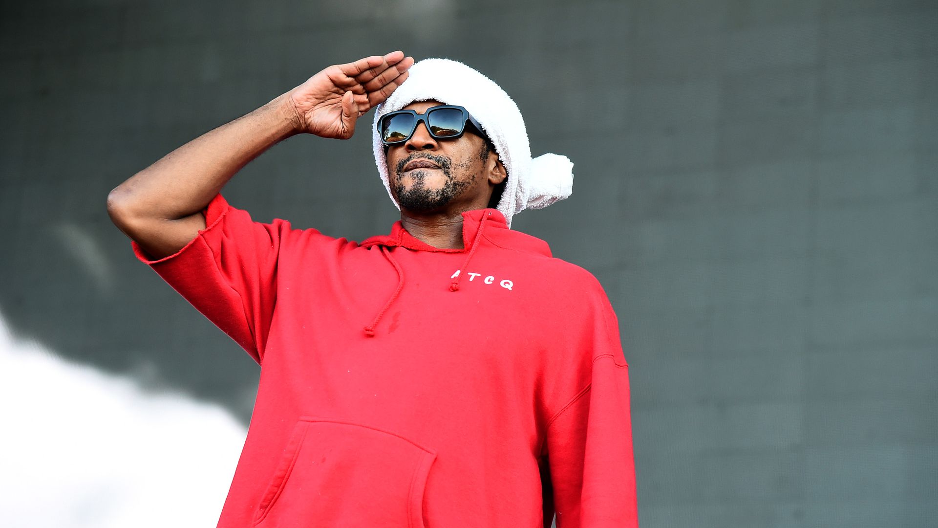 Q-Tip from A Tribe Called Quest performs on stage.