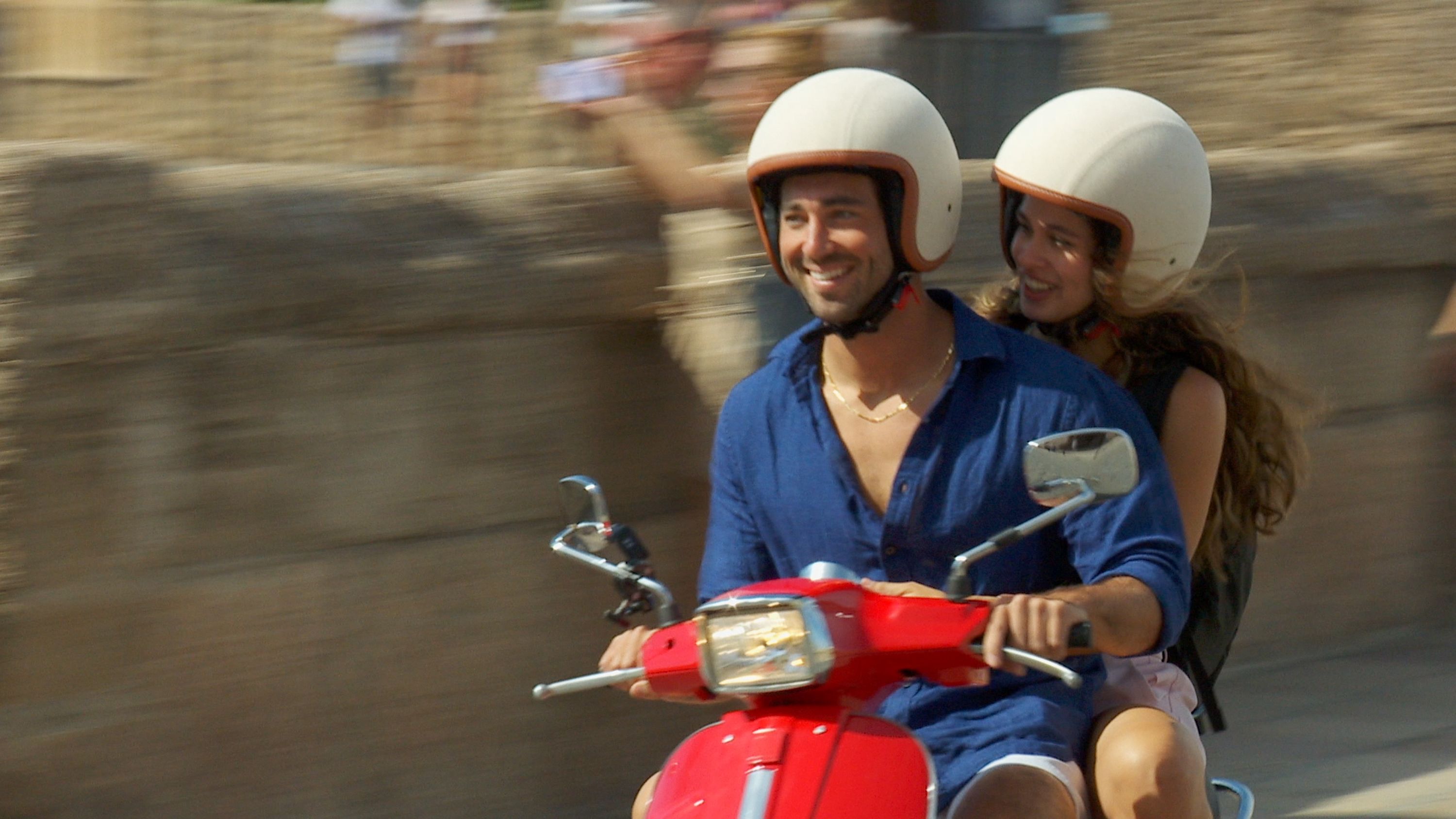 Photo shows Joey and Kelsey on a scooter.