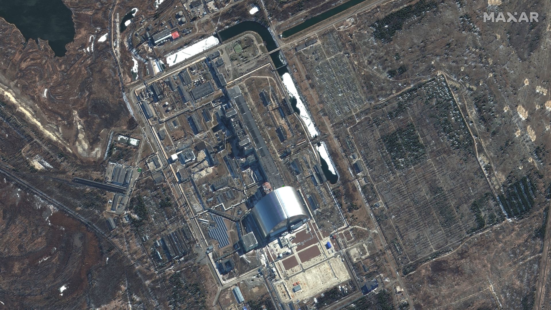 An overview and close-up view of Chernobyl nuclear facilities captured by satellite imagery