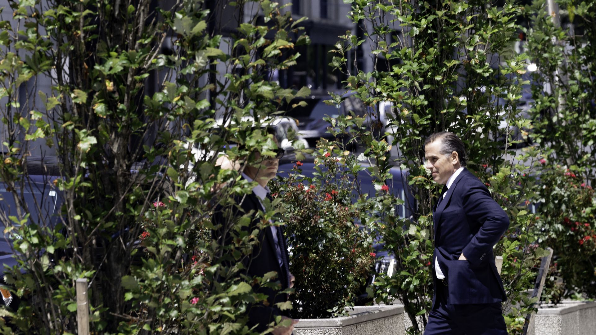 Hunter Biden, son of US President Joe Biden, right, exits federal court in Wilmington, Delaware, US, on Wednesday, July 26, 2023