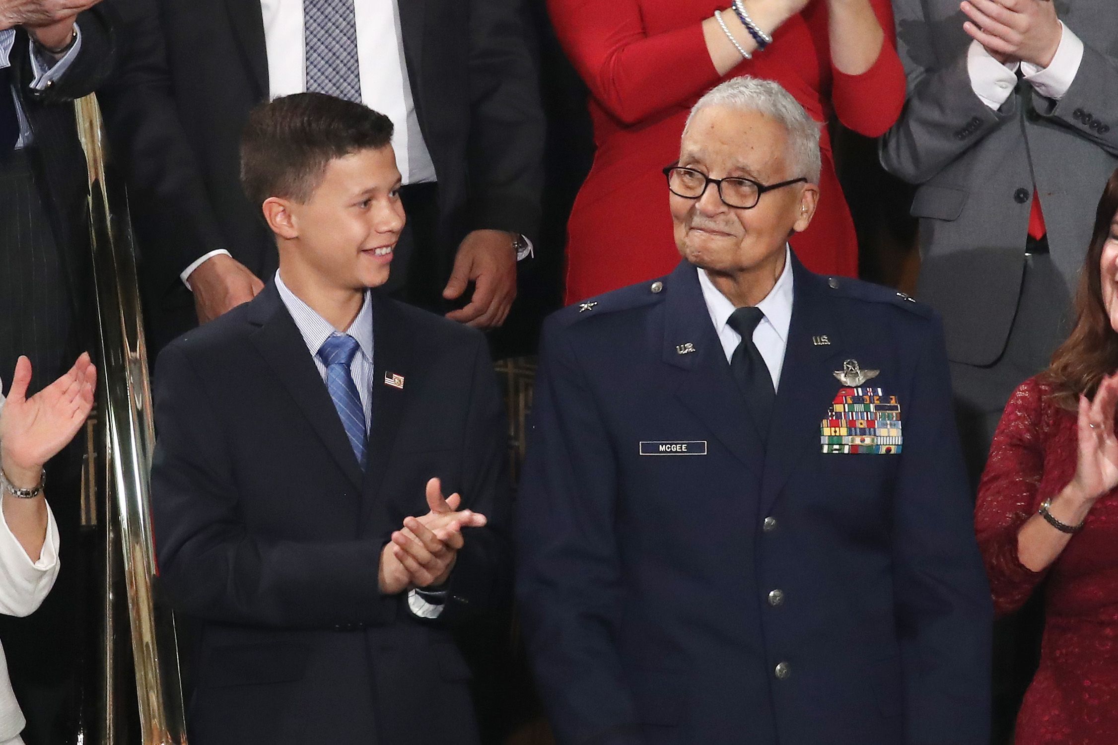 Retired U.S. Air Force Col. Charles McGee, who served with the Tuskagee Airmen, attends the State of the Union address with his great- grandson Iain Lanphier 