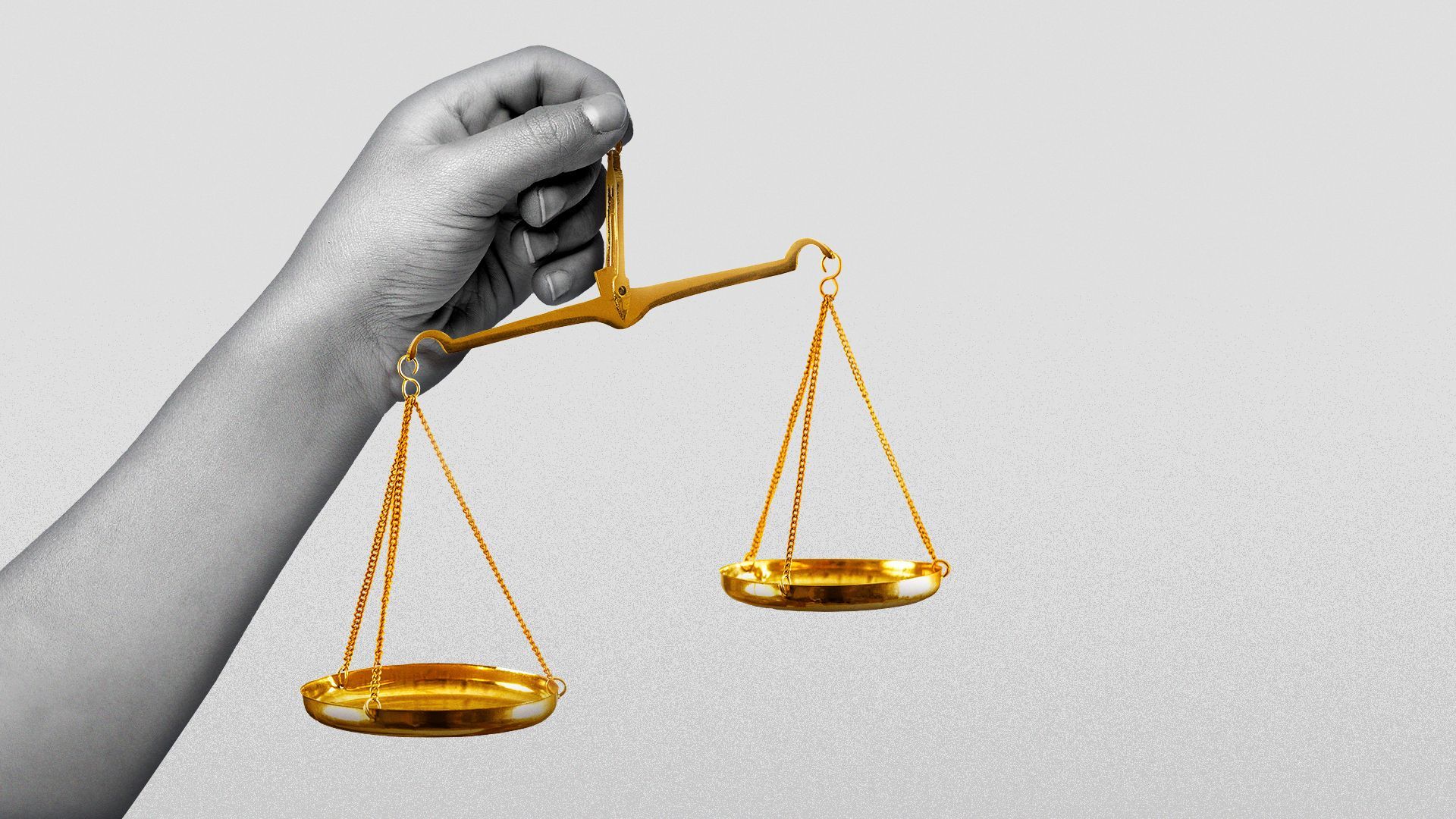 Illustration of a child's hand holding unbalanced scales.