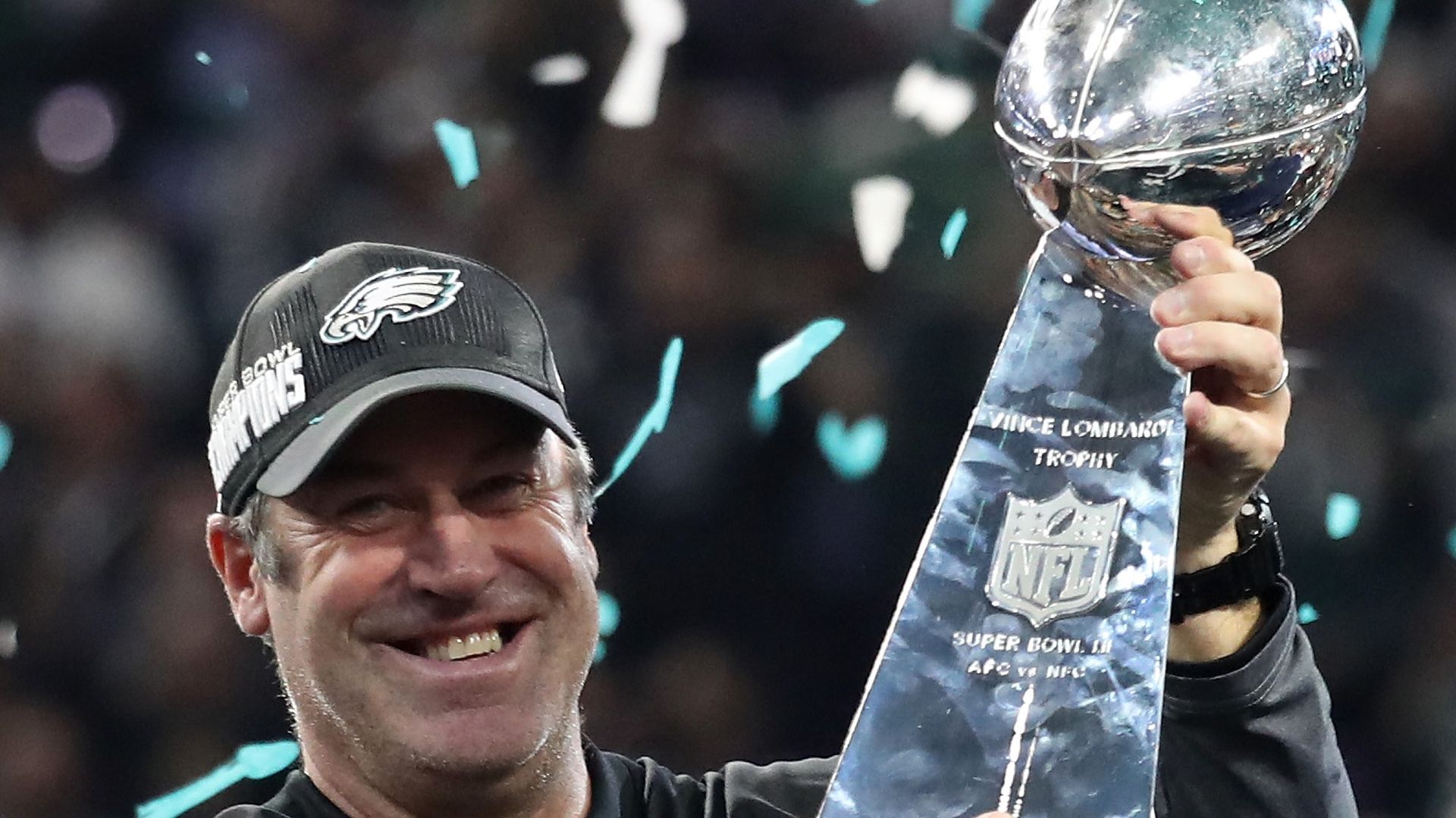 Former Eagles head coach Doug Pederson holds Lombardi trophy in 2018 Super Bowl.