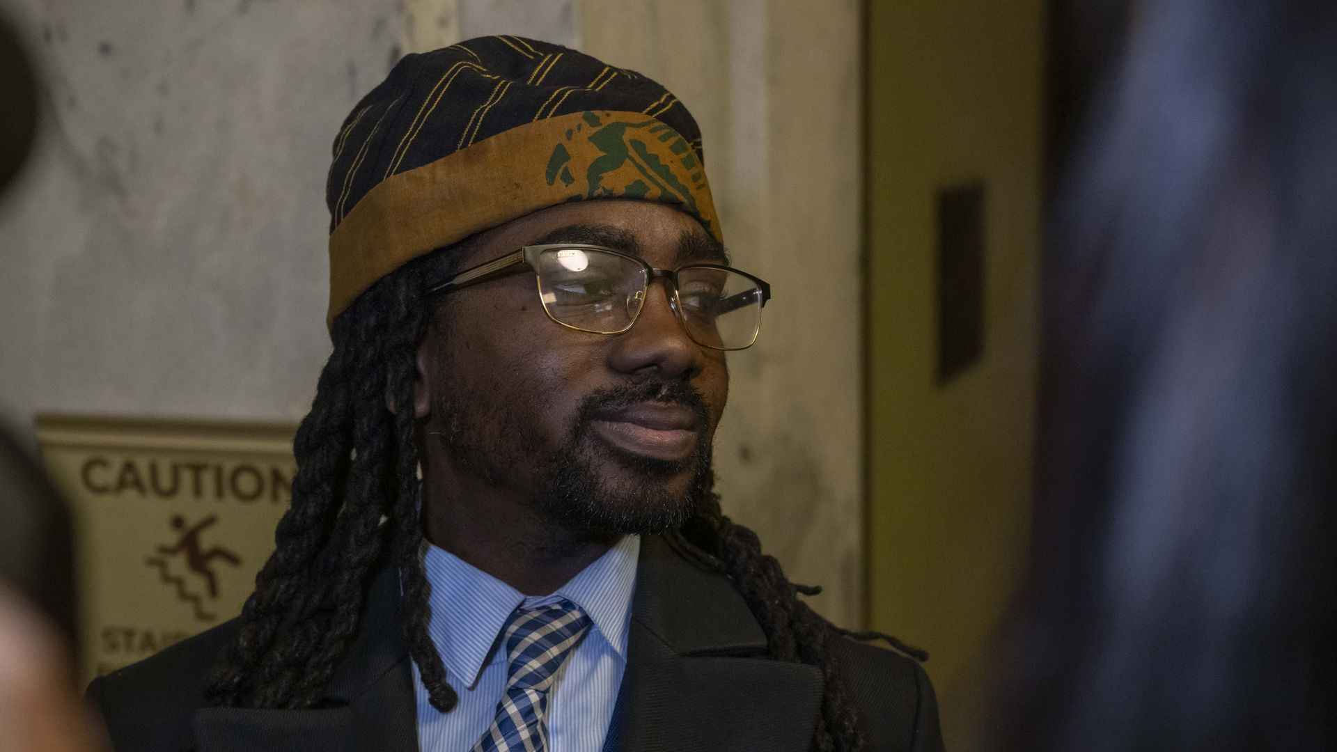A photograph of Trayon White in a hallway