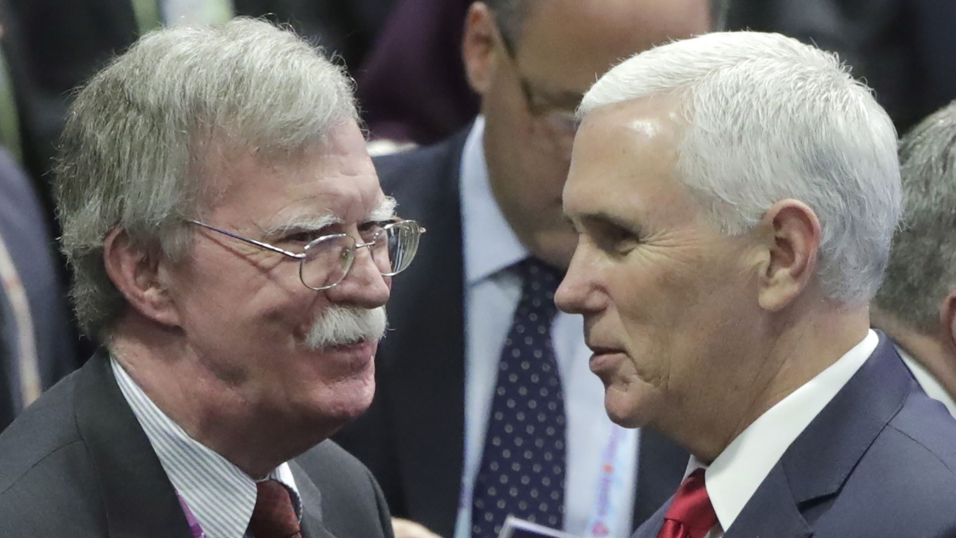 US National Security Adviser John Bolton and US Vice President Mike Pence shake hands