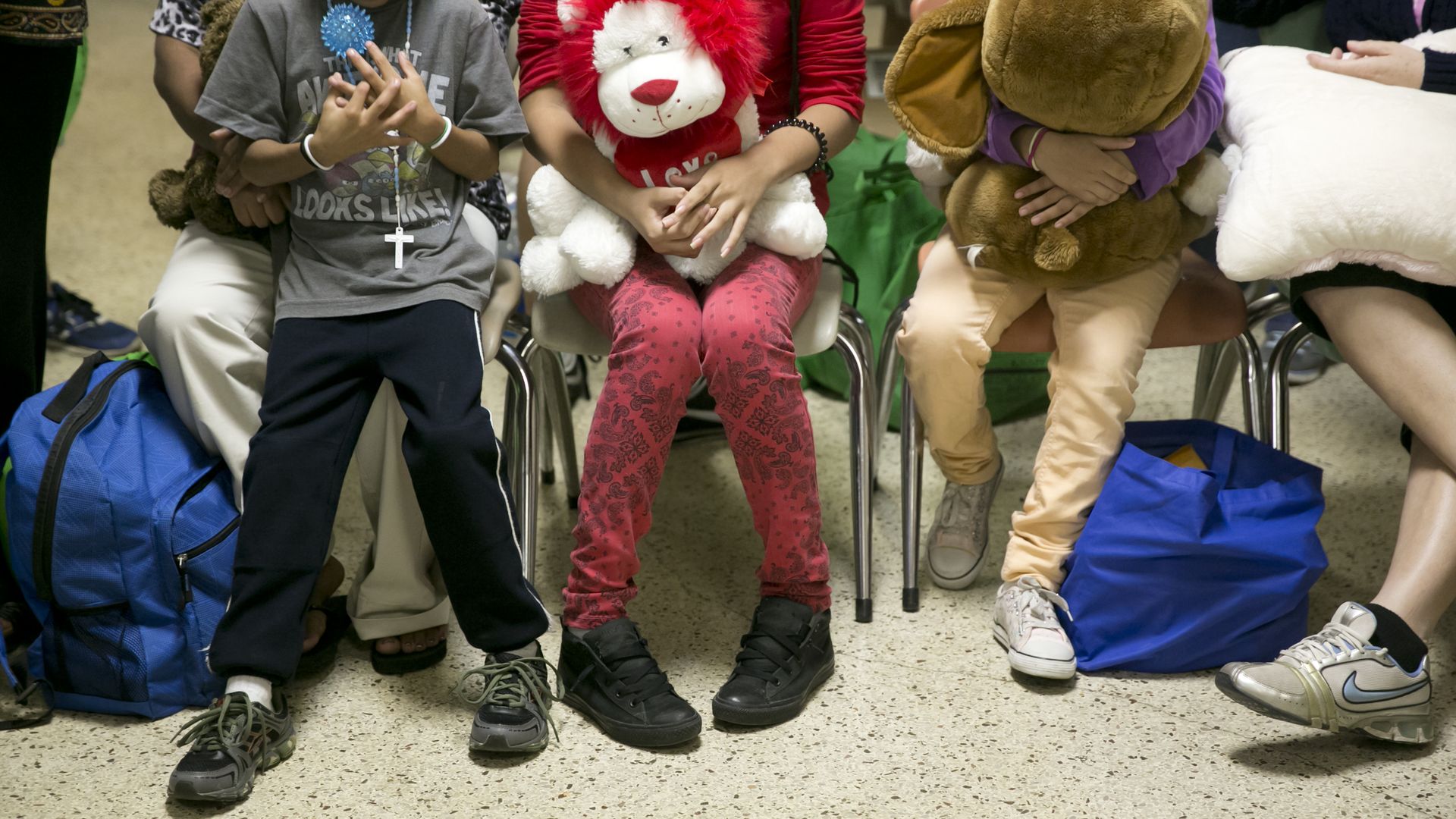 Immigrants, mostly women and children receiving food, shelter and medical help at a shelter in McAllen, Texas.