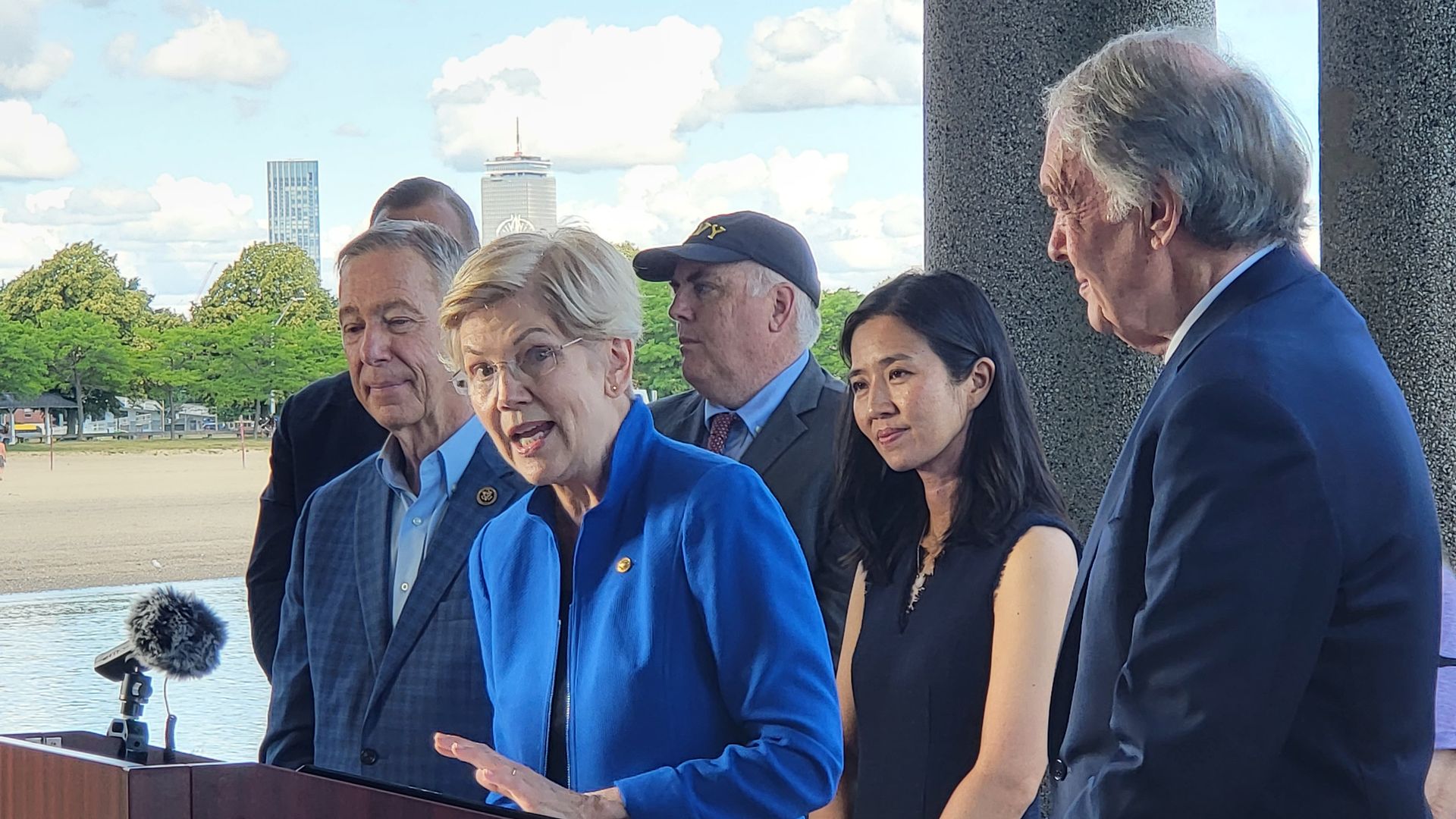 Sen. Elizabeth Warren with Rep. Stephen Lynch, City Council President Ed Flynn, Mayor Michelle Wu and Sen. Ed Markey in Dorchester Tuesday.