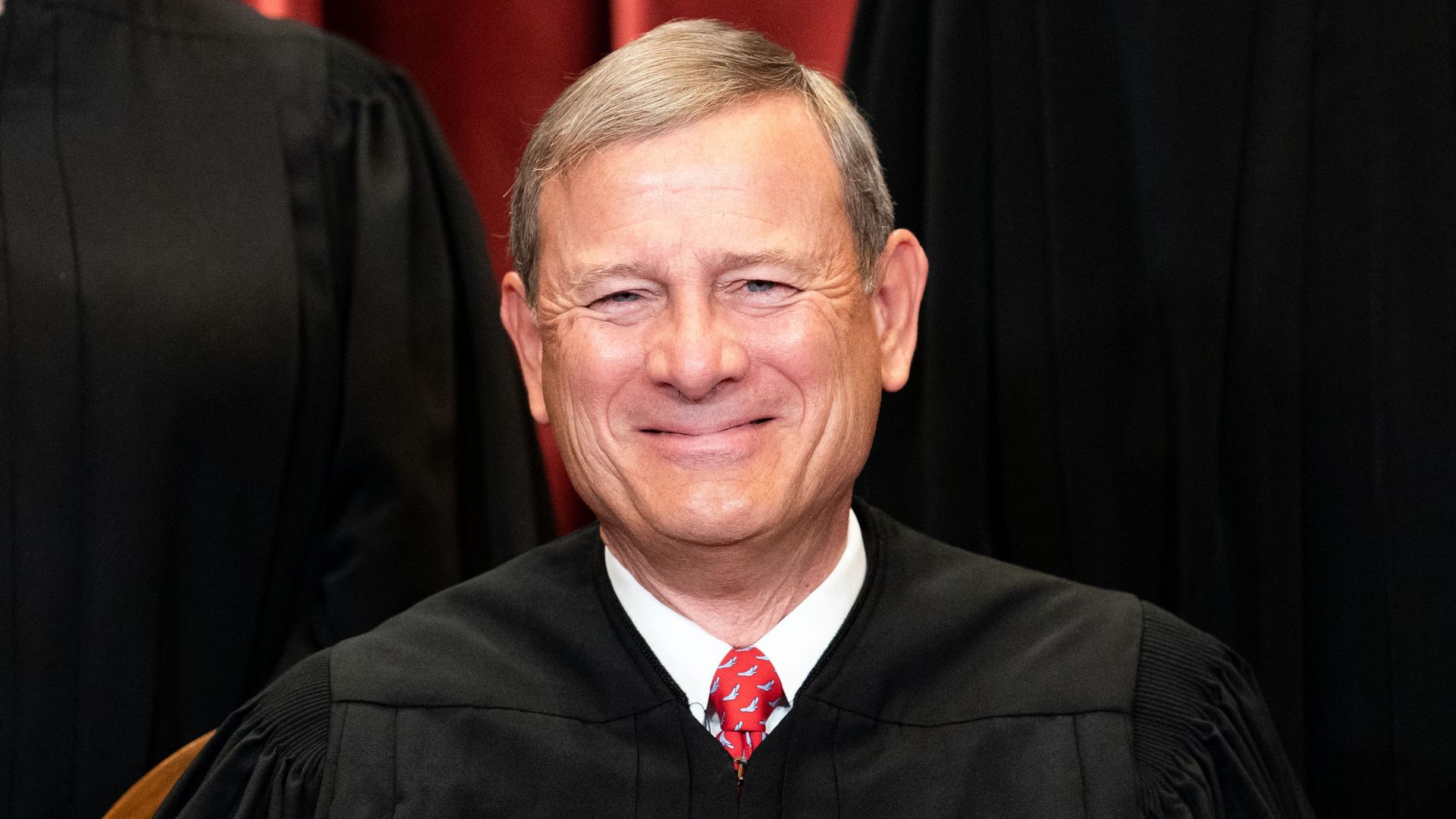 Chief Justice John Roberts sits during a group photo of the Justices at the Supreme Court in Washington, DC on April 23, 2021
