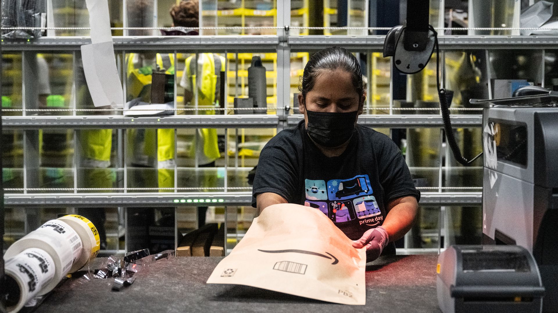 An Amazon worker preparing packages at a same-day fulfillment center in New York City on July 16.