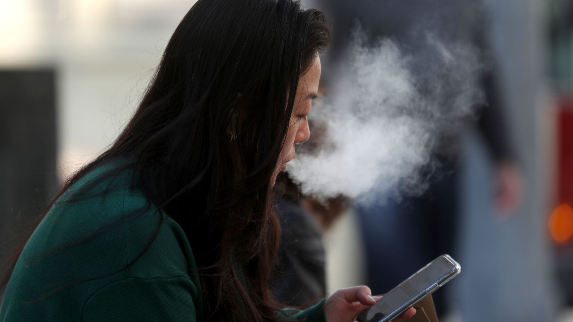 A pedestrian smokes an e-cigarette on November 08, 2019 in San Francisco, California. 