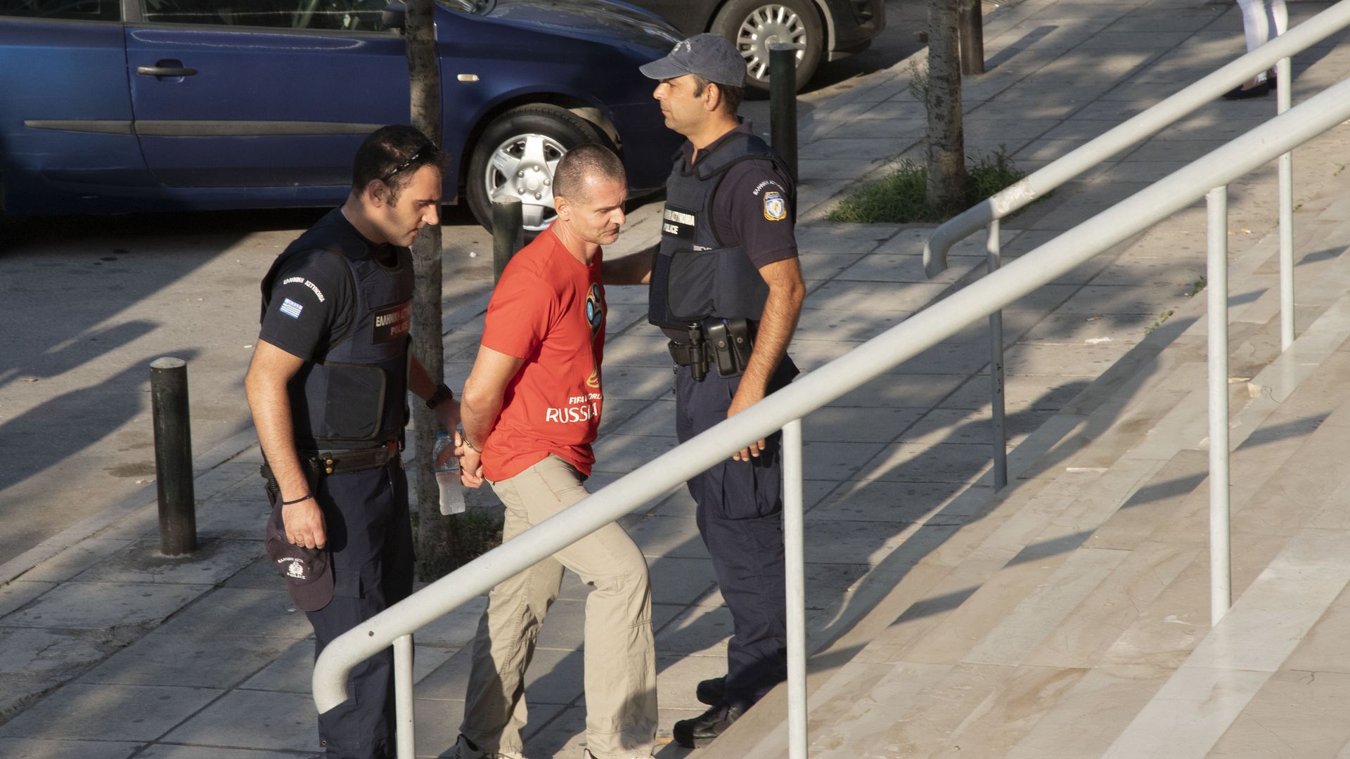 vinnik on stairs in cuffs