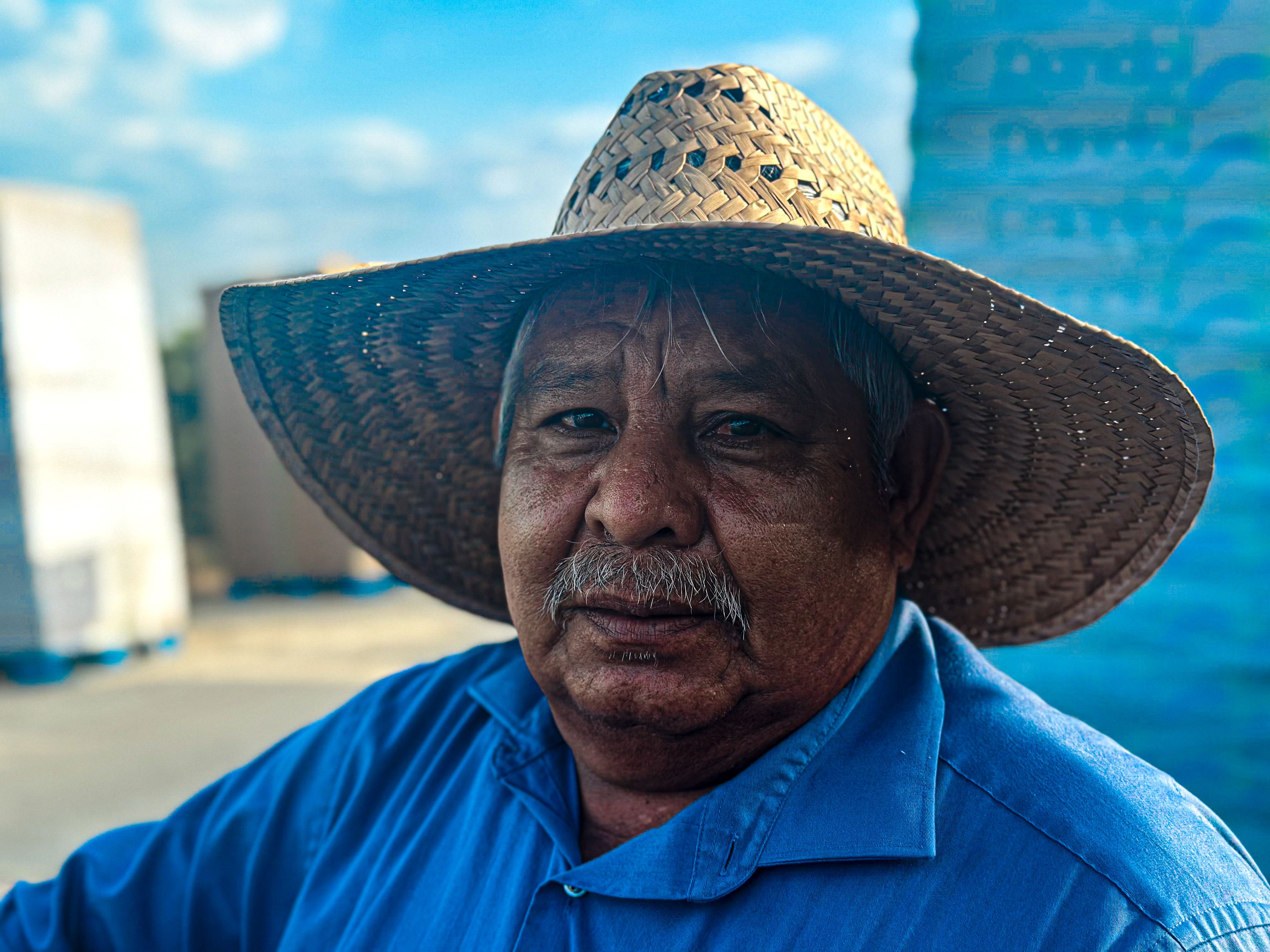Angel Ramos, 67, Richgrove, California, takes a break from picking grape on July 18, 2024, in Lamont, California.