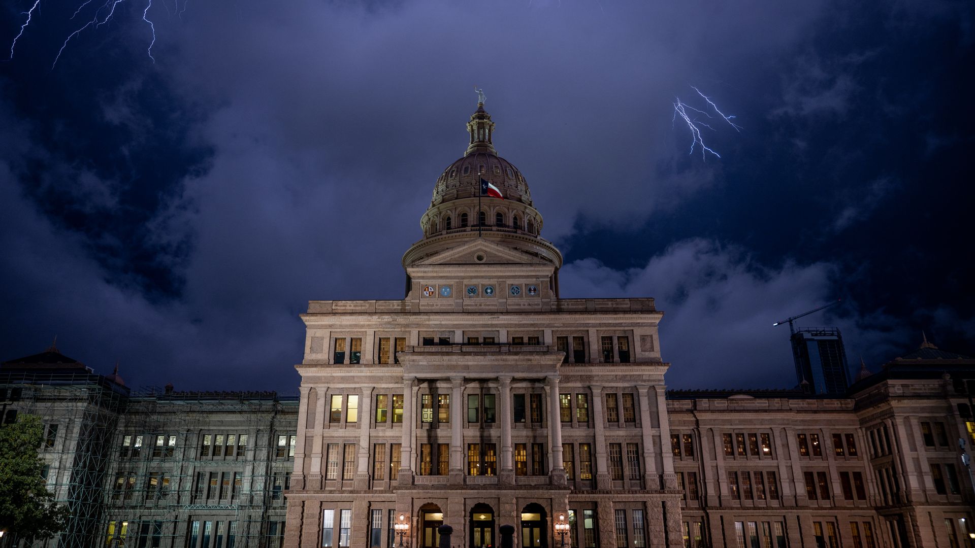 Lightning and a dark sky above the Texas capitol building