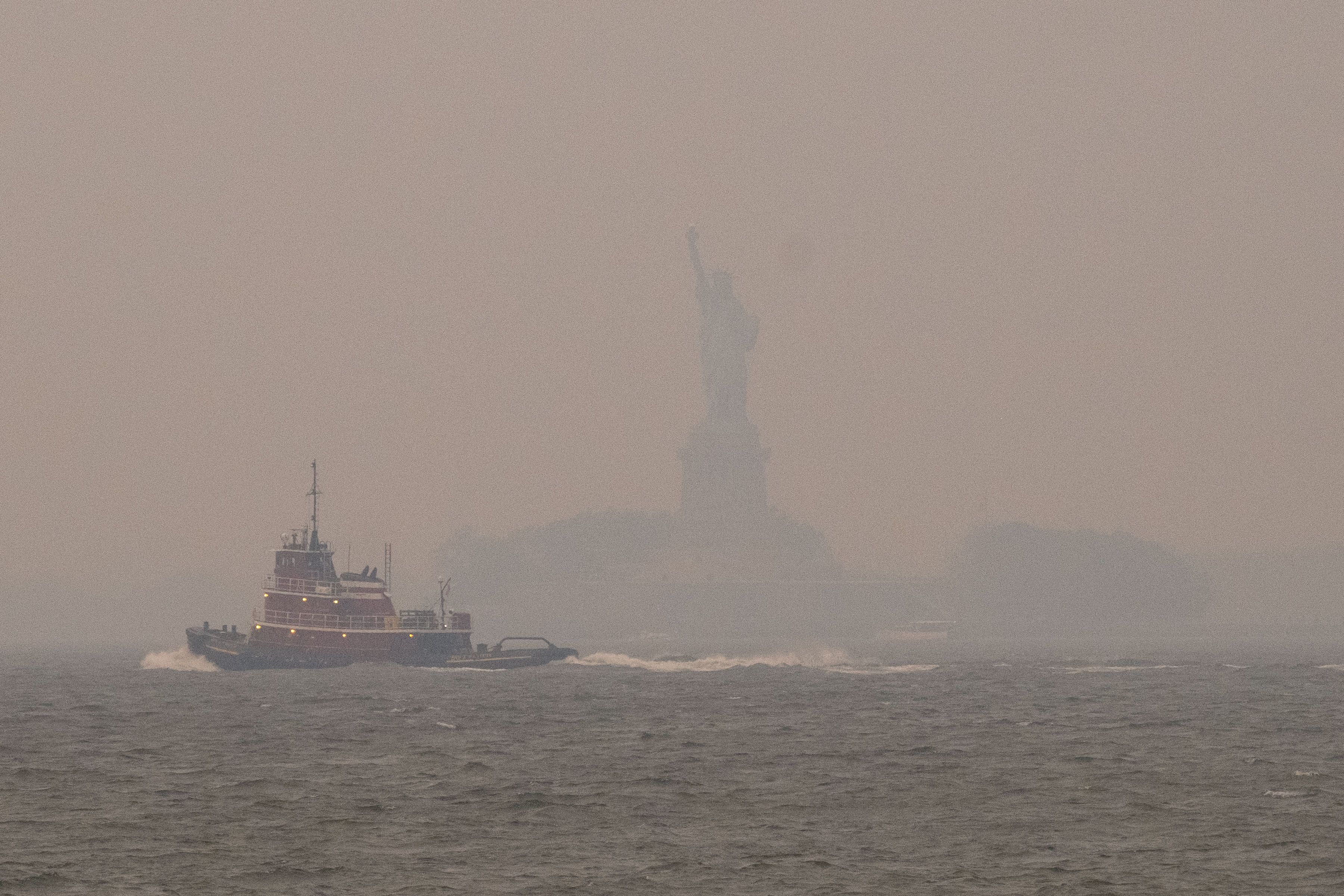 Wildfire smoke engulfs the Statue of Liberty.