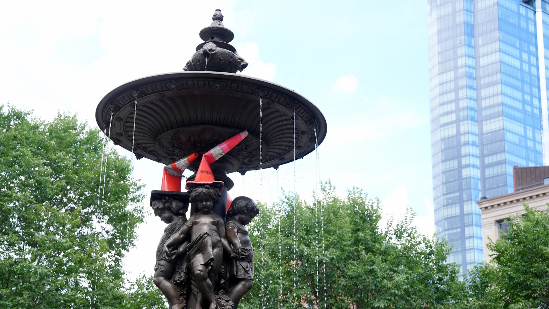 Orange traffic cones cover statues on the Brewer Fountain in Boston Common, a prank associated with visiting Scotland fans during the 2026 FIFA World Cup in Boston.