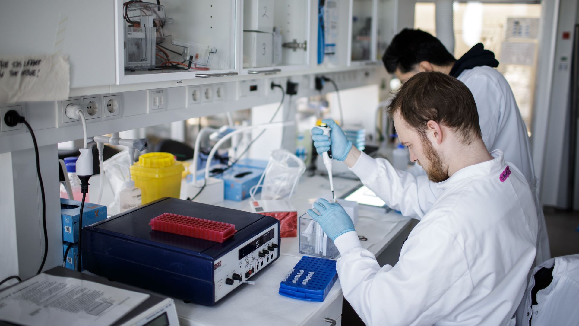 Researchers in a lab work on a potential coronavirus vaccine