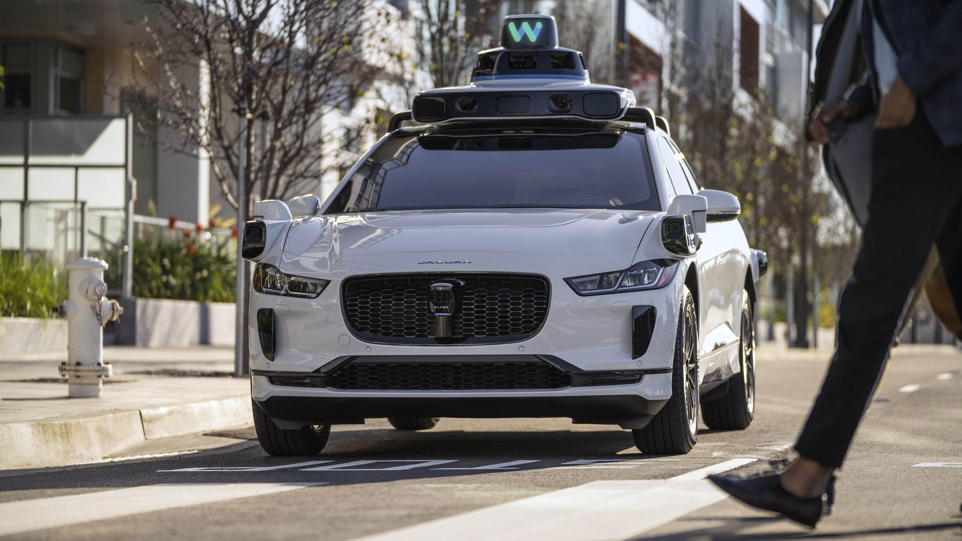 A photo of a car that is part of the autonomous vehicle company Waymo.