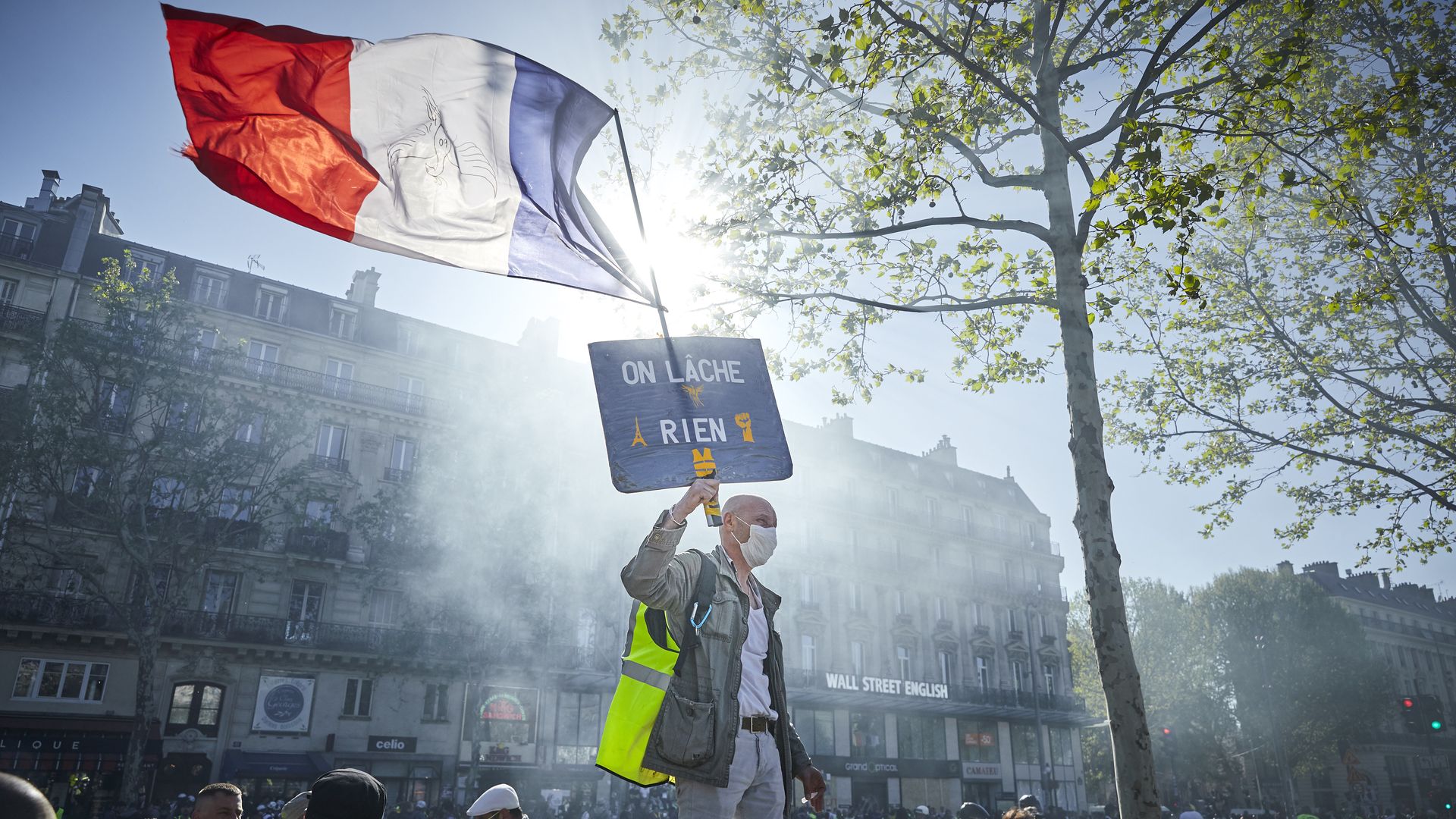 Man protesting in Paris against economic inequality