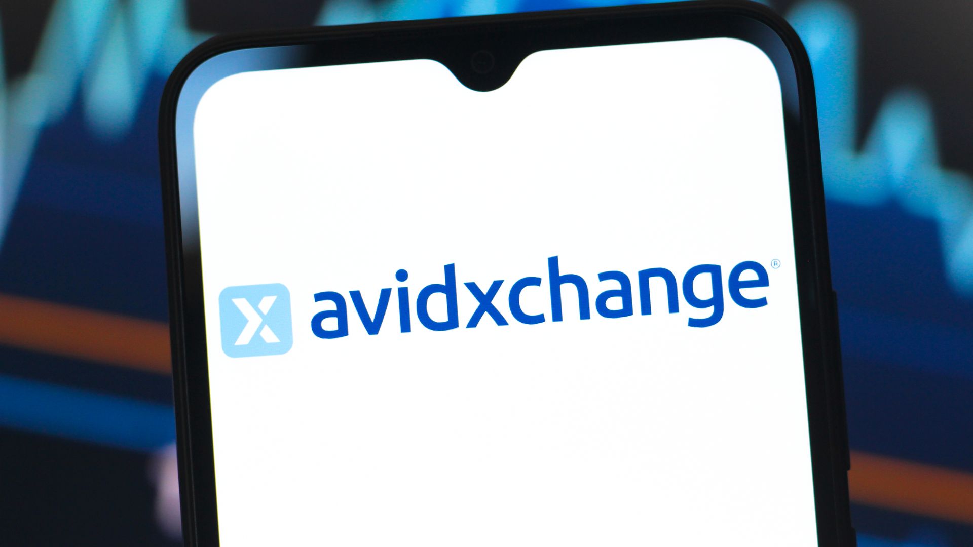 AvidXchange Holdings logo is seen displayed on a smartphone screen