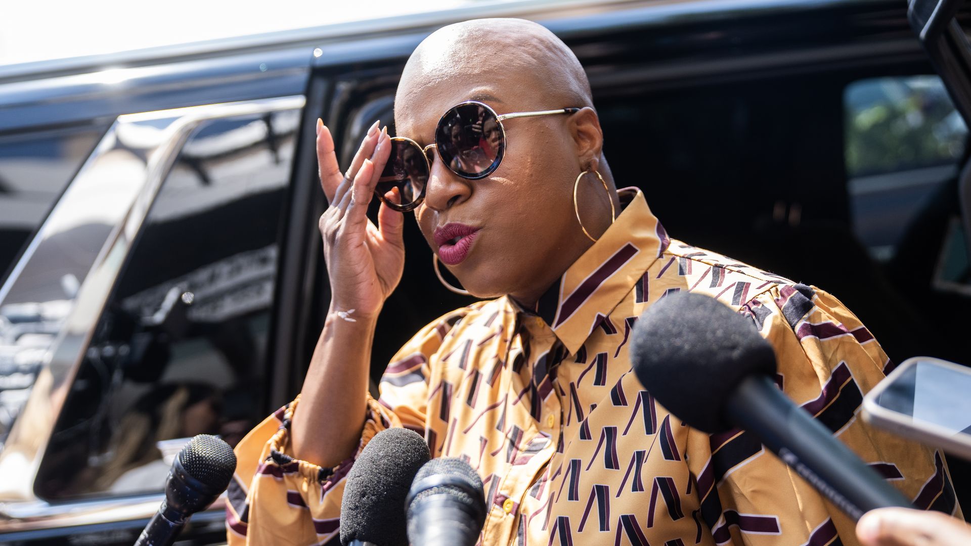 Rep. Ayanna Pressley leaves a car