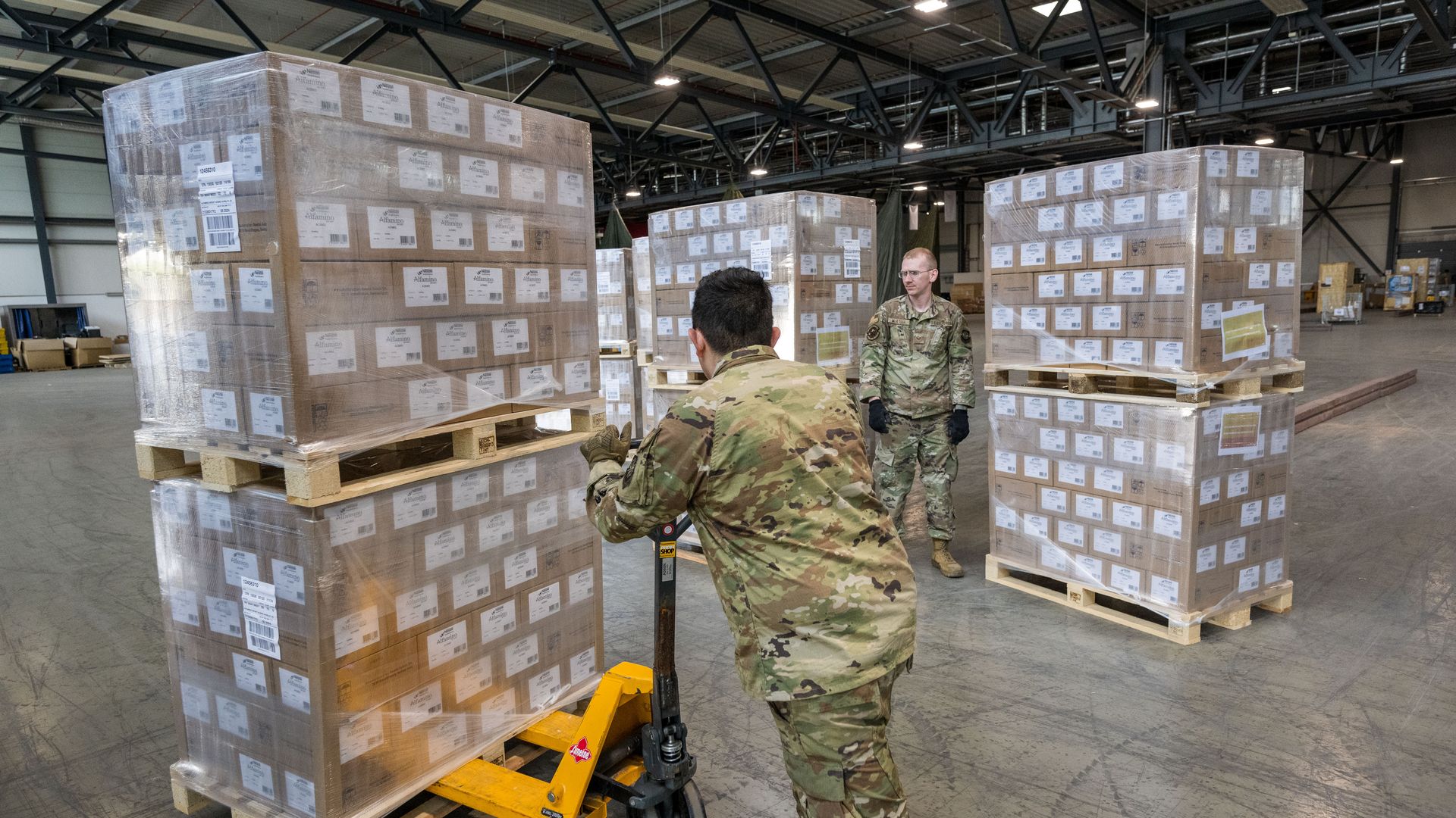 U.S. airmen load pallets with baby formula