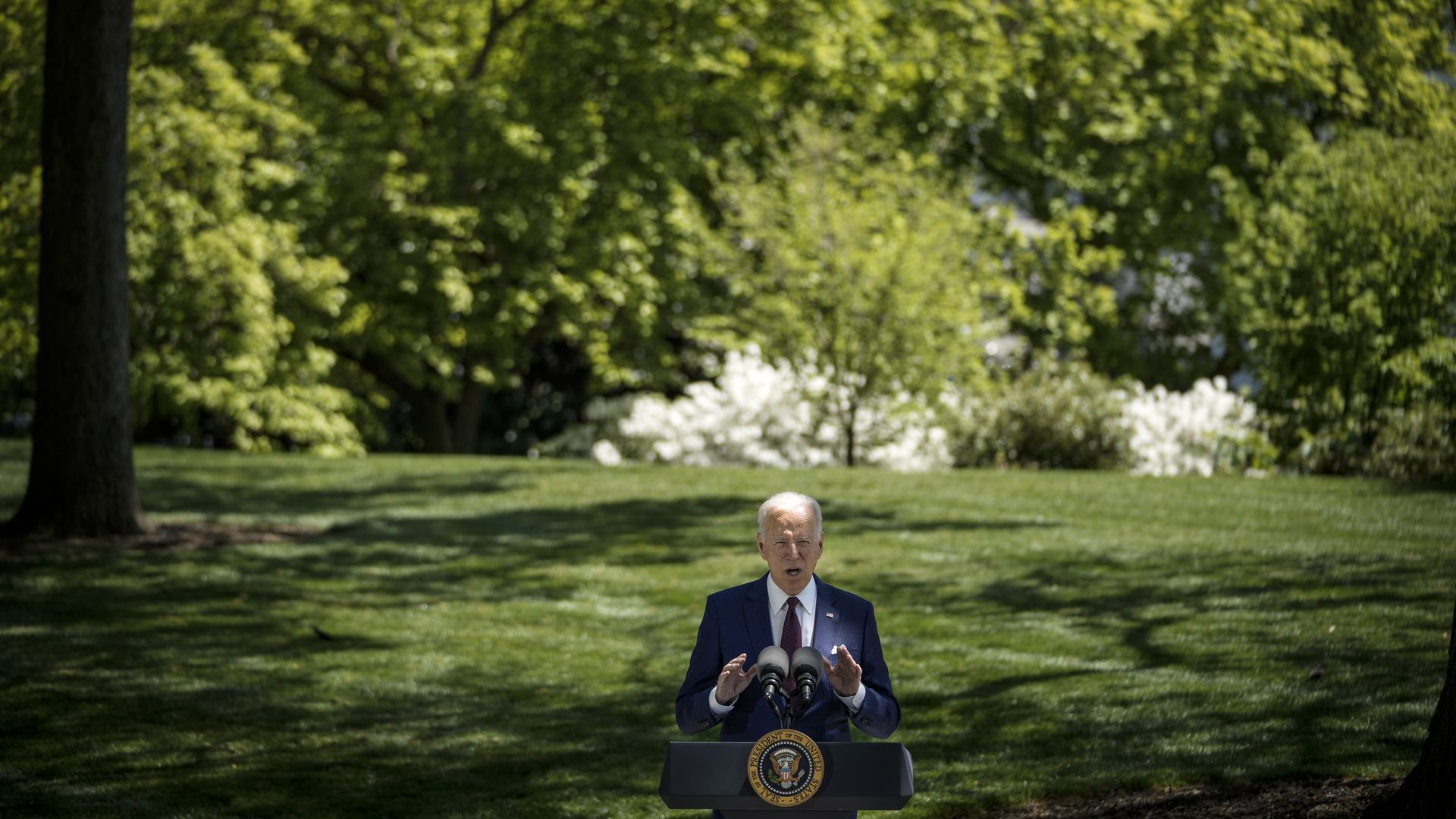 President Biden is seen speaking about the coronavirus from the North Lawn of the White House.