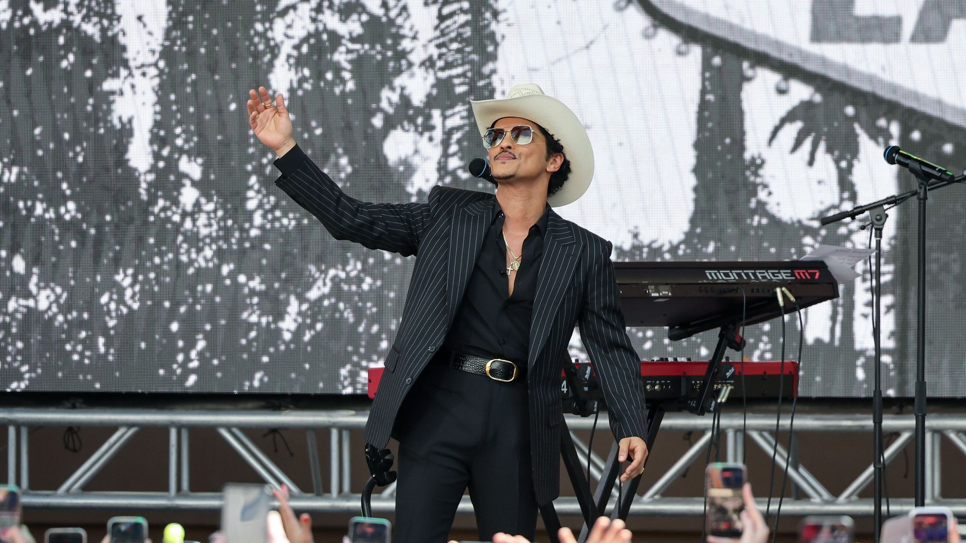 Bruno Mars gestures onstage after a parade honoring his impact on Las Vegas entertainment on April 10, 2026 in Las Vegas, Nevada. 