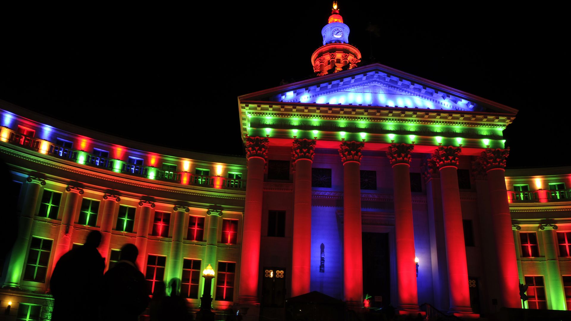 People gather to see the switch flipped for the lights on the City and County building in Denver. Photo: Hyoung Chang/The Denver Post via Getty Images