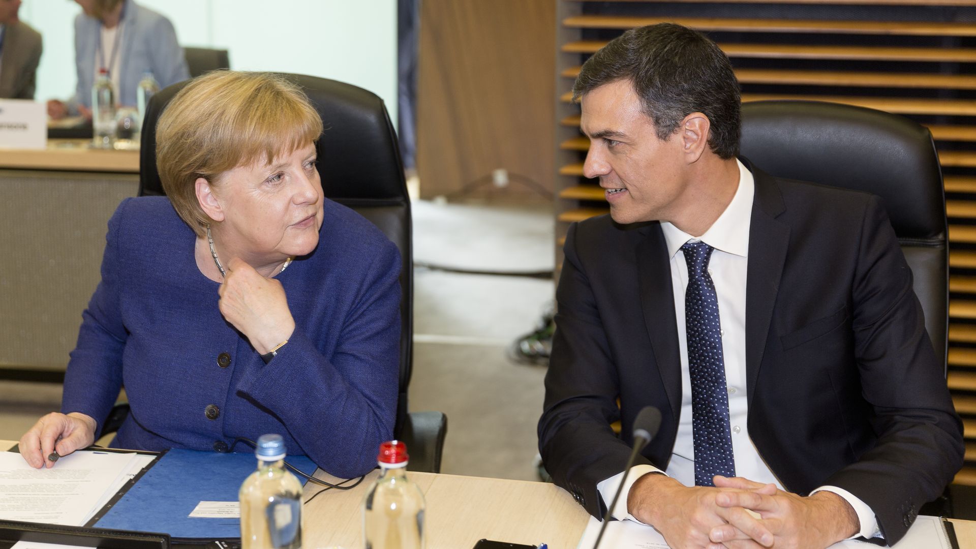 German Chancellor Angela Merke talks with Spanish Prime Minister Pedro Sanchez before a meeting on migration and asylum issues on June 24, 2018 in Brussels, Belgium.
