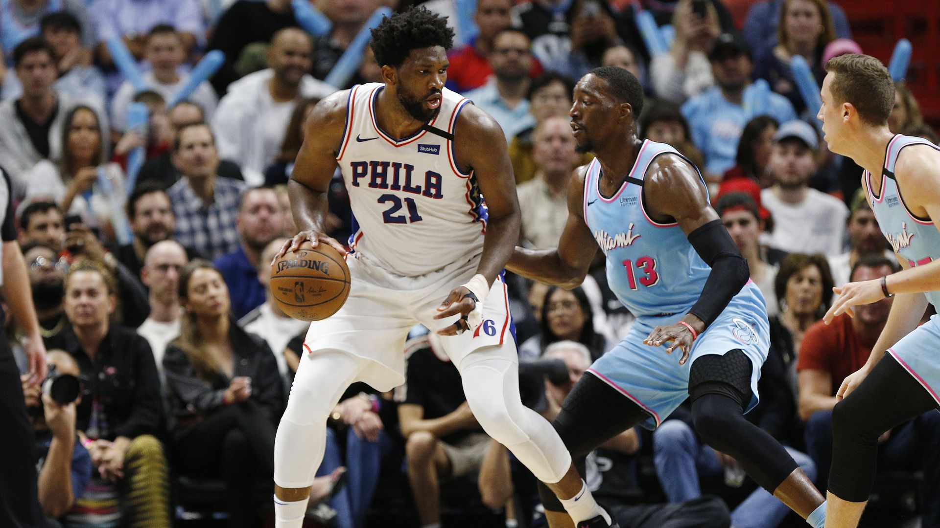 Joel Embiid #21 of the Philadelphia 76ers is defended by Bam Adebayo #13 of the Miami Heat during the second half at American Airlines Arena on February 03, 2020 in Miami, Florida.