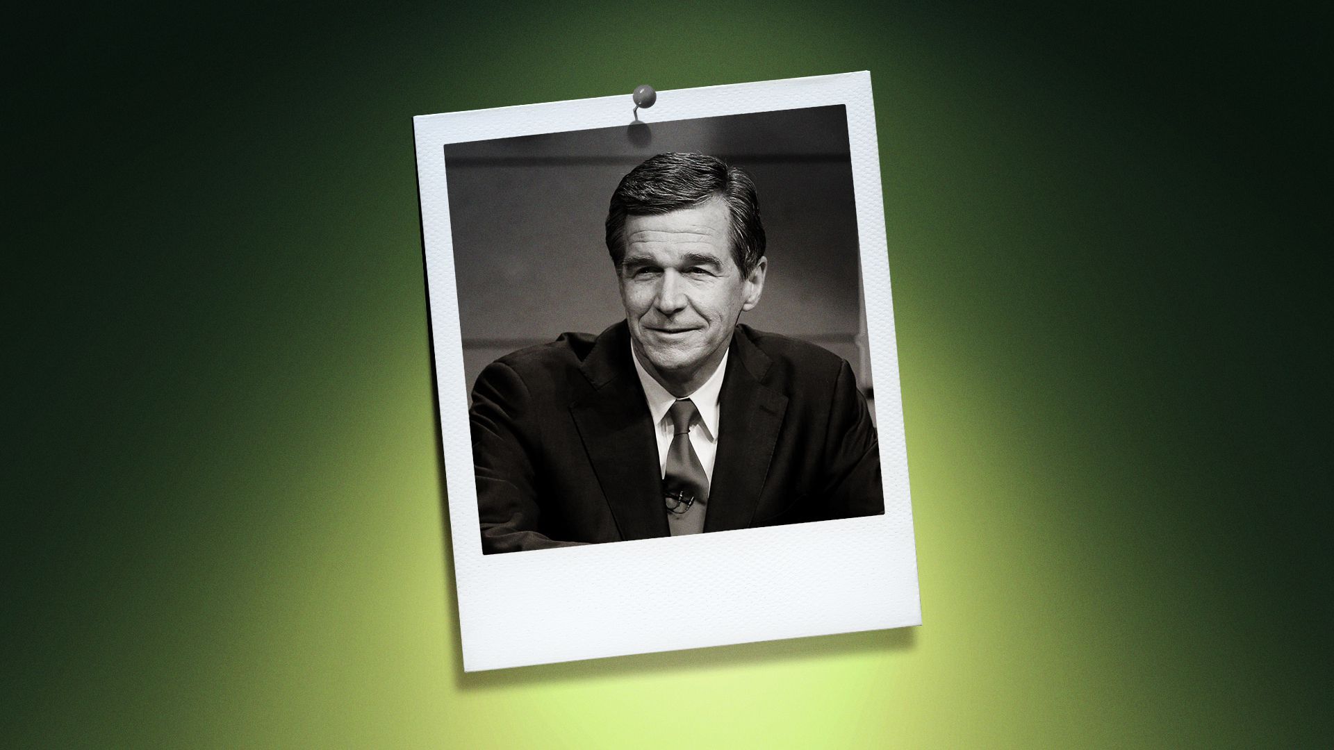 Photo illustration of Roy Cooper in the center of a Polaroid photo under a green spotlight.