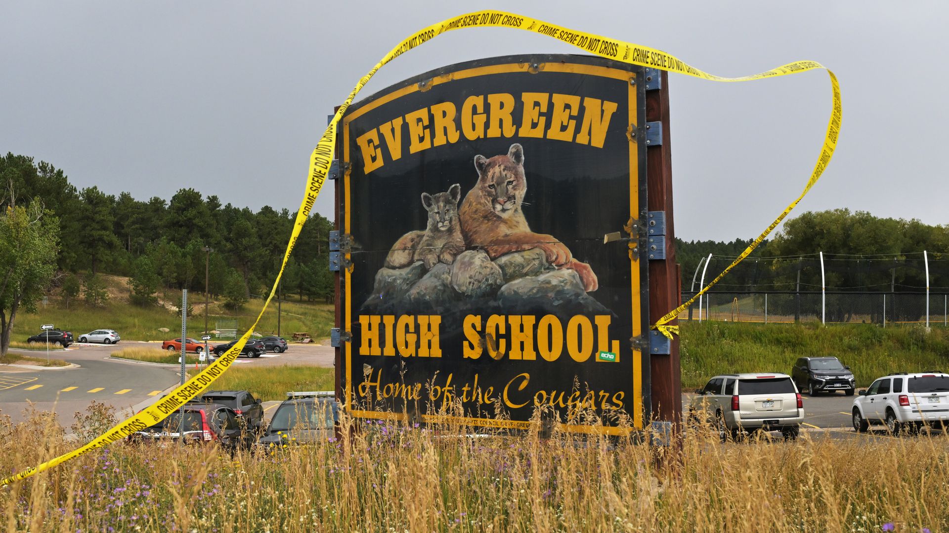 Crime scene tape blows in the wind as rain begins to fall outside Evergreen High School on Sept. 11, 2025. Photo: RJ Sangosti/Denver Post via Getty Images