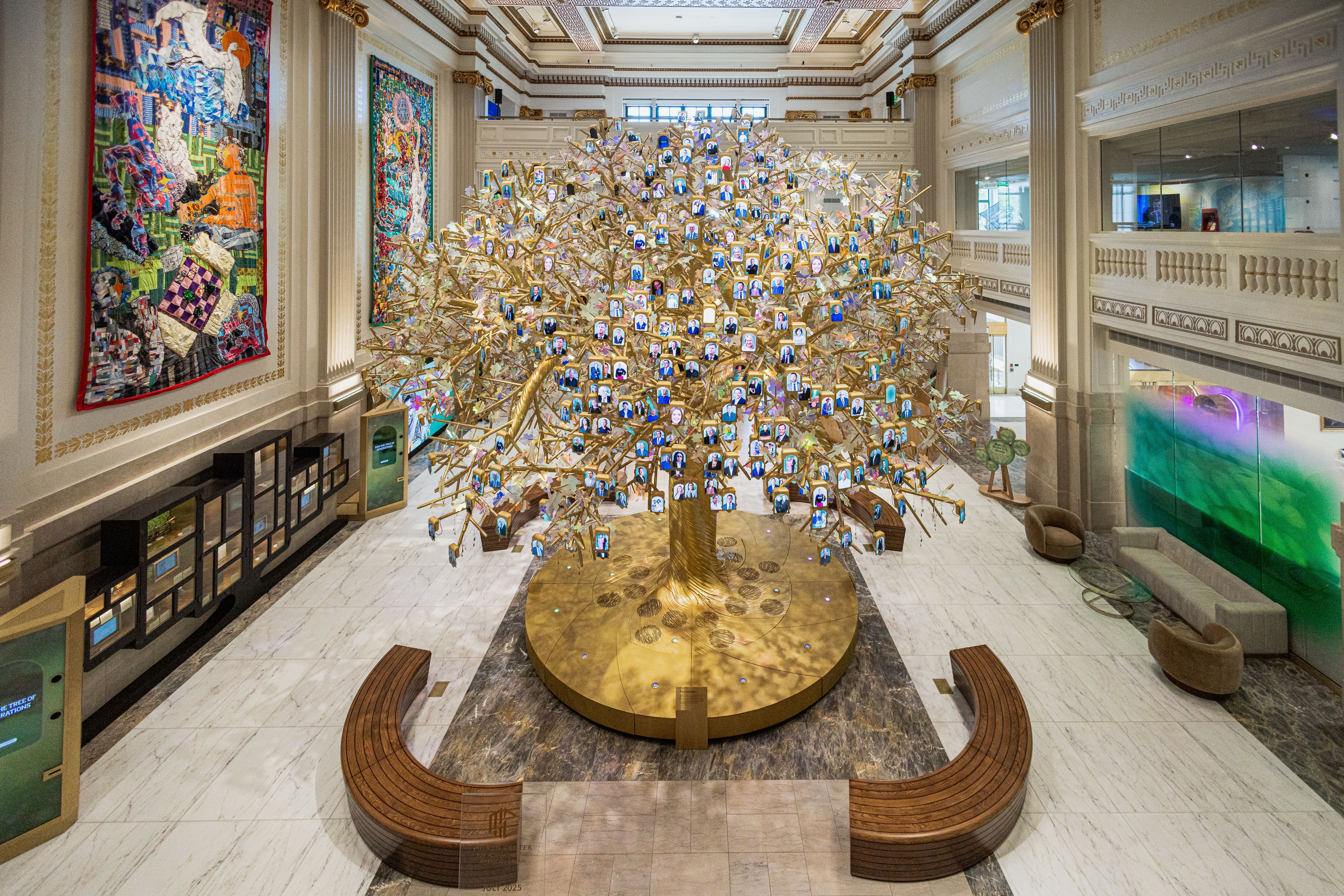 A word cloud sculptural chandelier, made up of 64 six-foot OLED panels, features constantly updated phrases describing the American Dream, contributed by visitors.