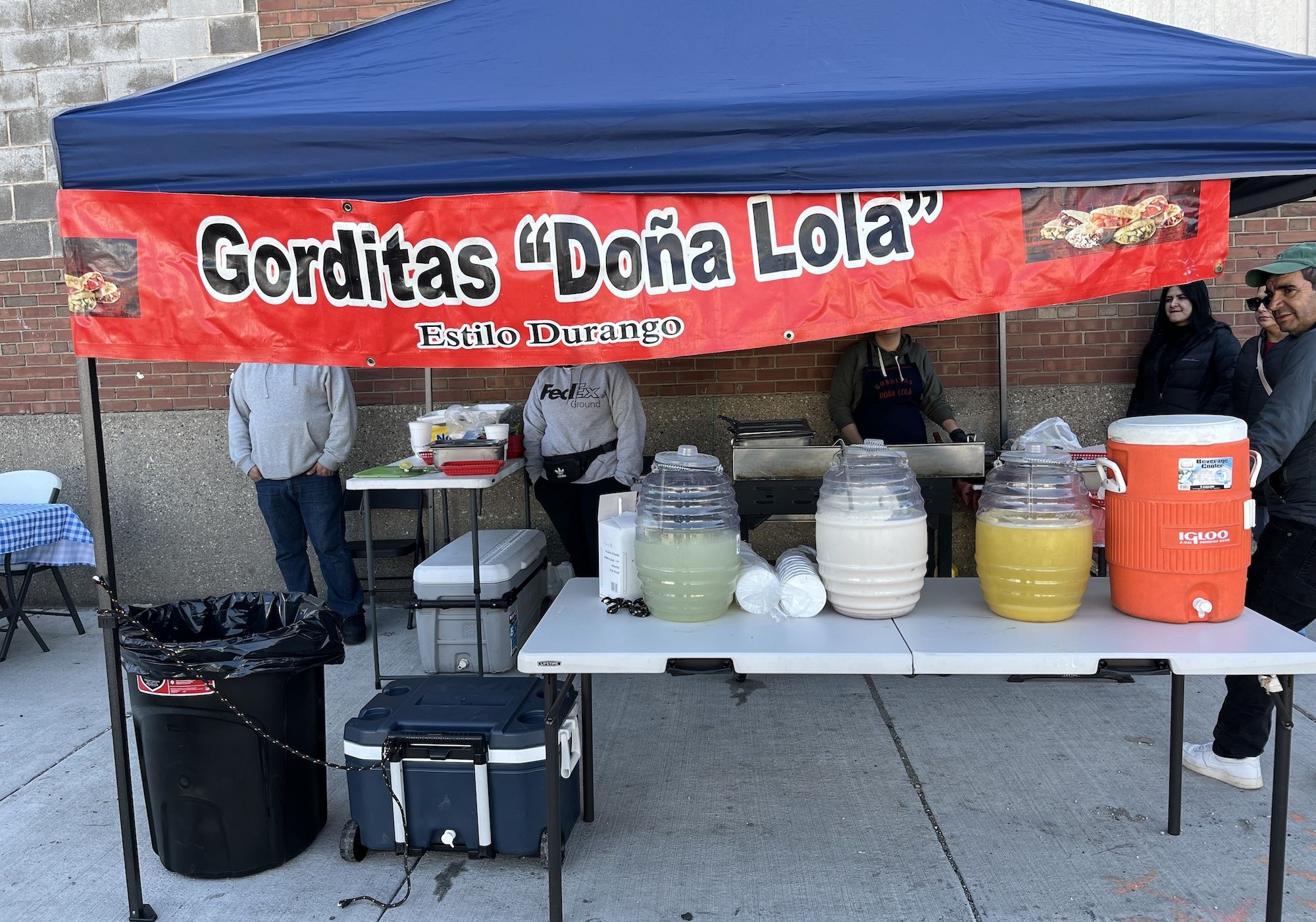 Tent with sign that reads Gorditas Dona Lola.