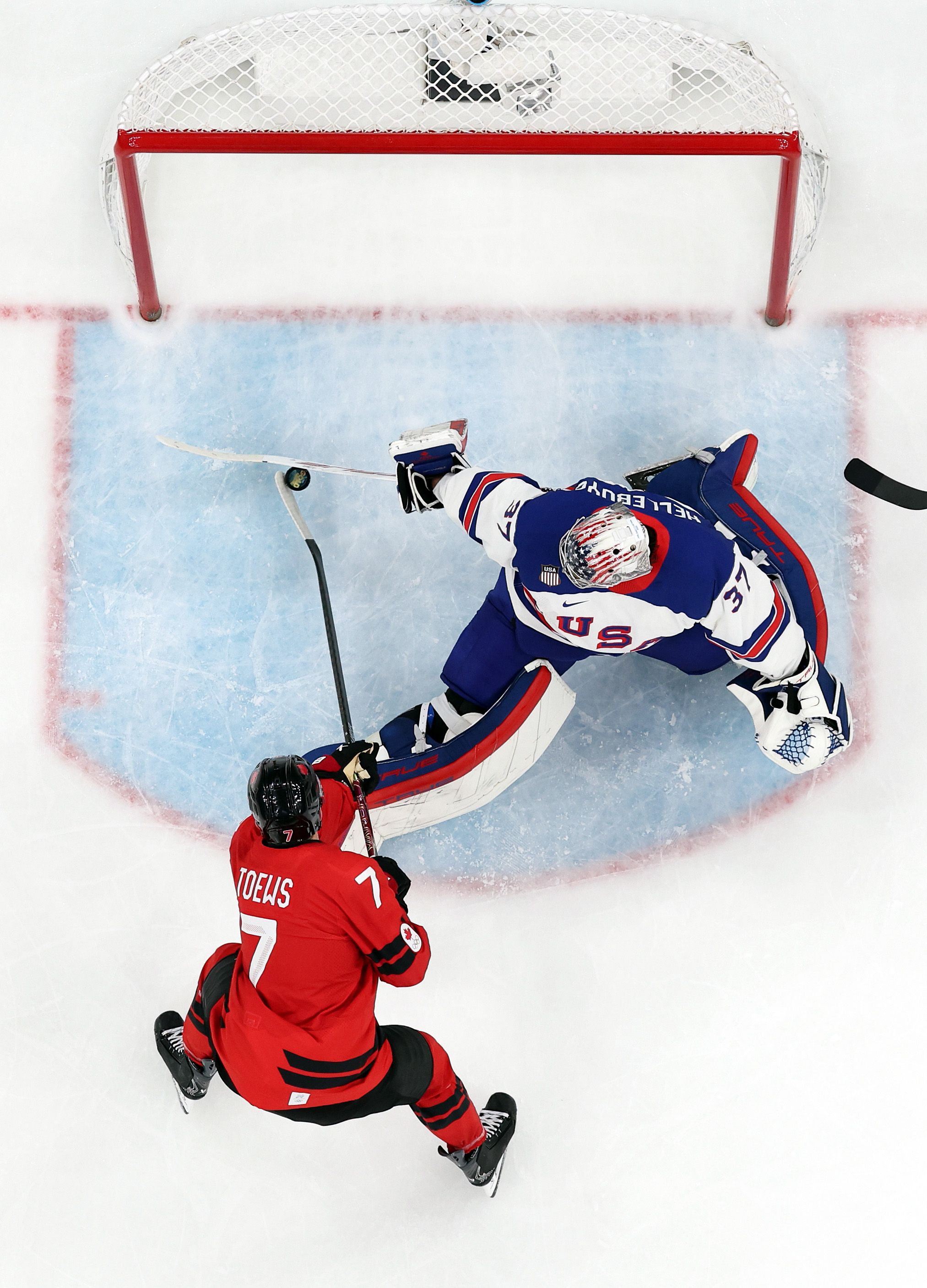 U.S. goalie Connor Hellebuyck makes a save in yesterday's gold medal game against Canada.