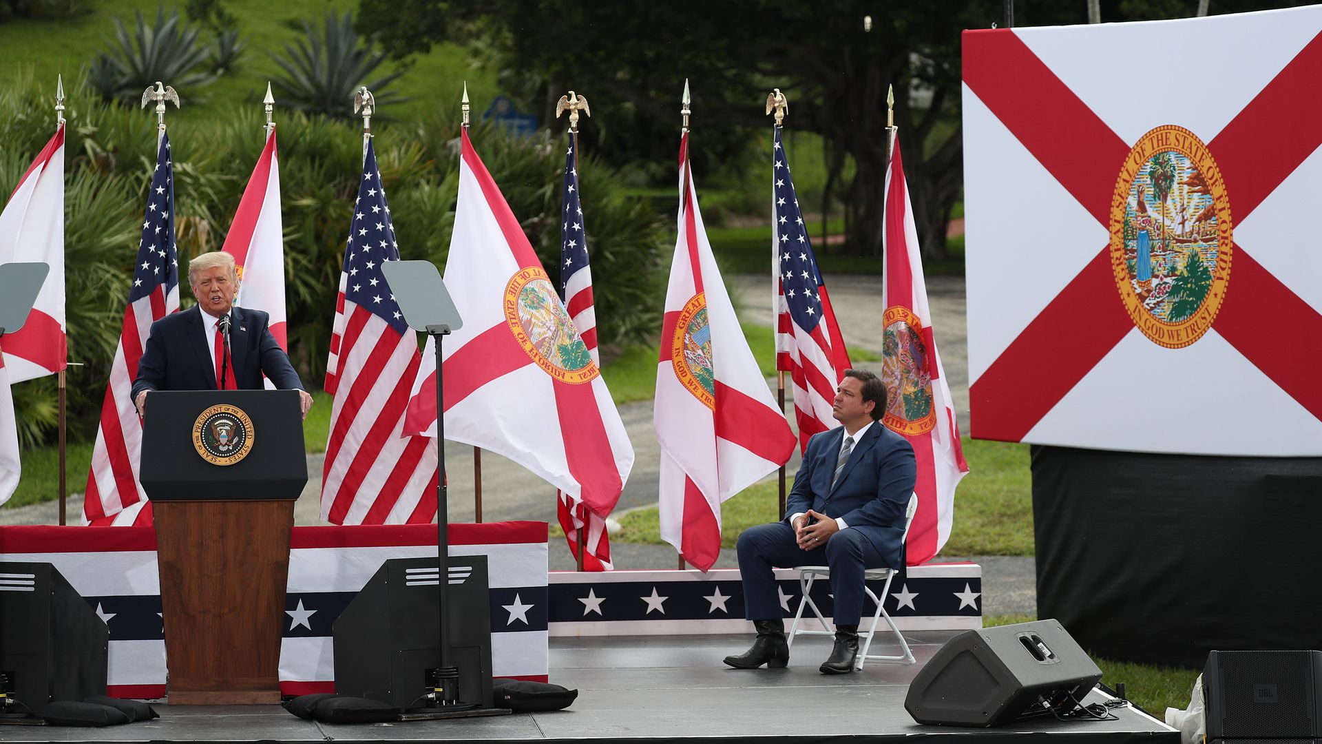 Florida Governor Ron DeSantis listens as President Donald Trump speaks about the environment during a stop at the Jupiter Inlet Lighthouse on September 08, 2020 in Jupiter, Florida.